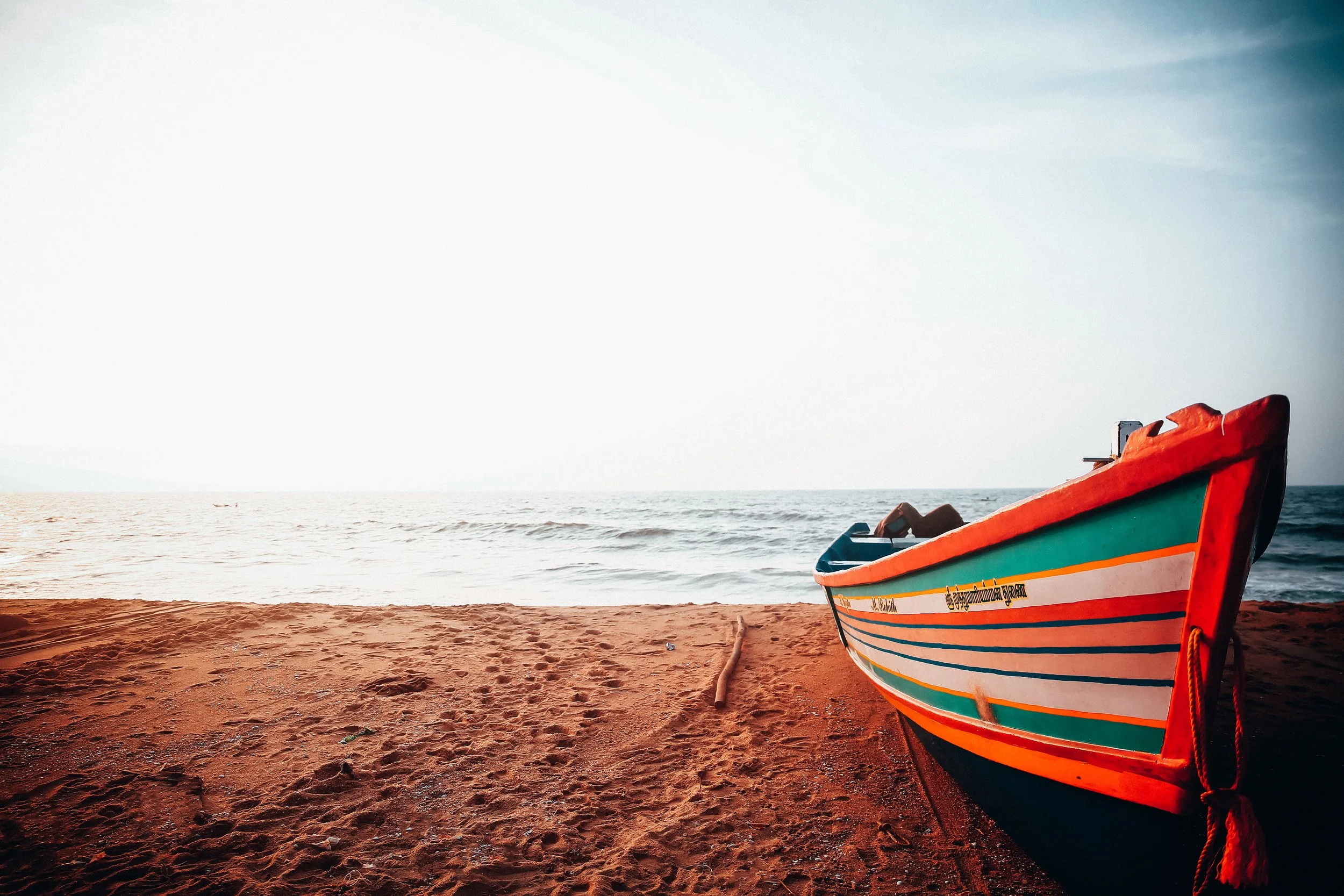 Colourful boat on the beach in Pondicherry, India: landscape photography by Shekhar Rawat