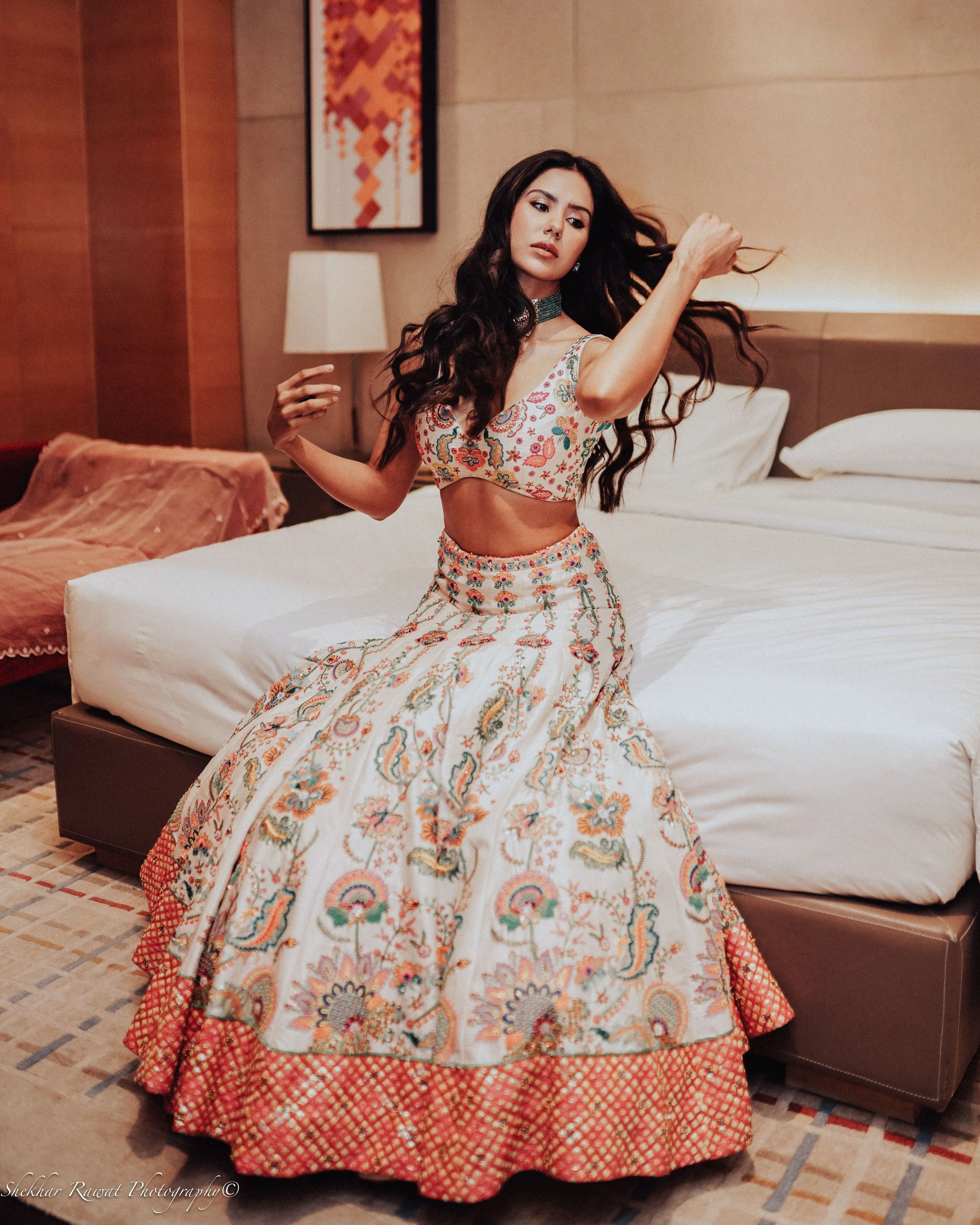 Model in a colourful Indian lehenga posing in a hotel suite, bridal fashion shoot by Melbourne photographer Shekhar Rawat