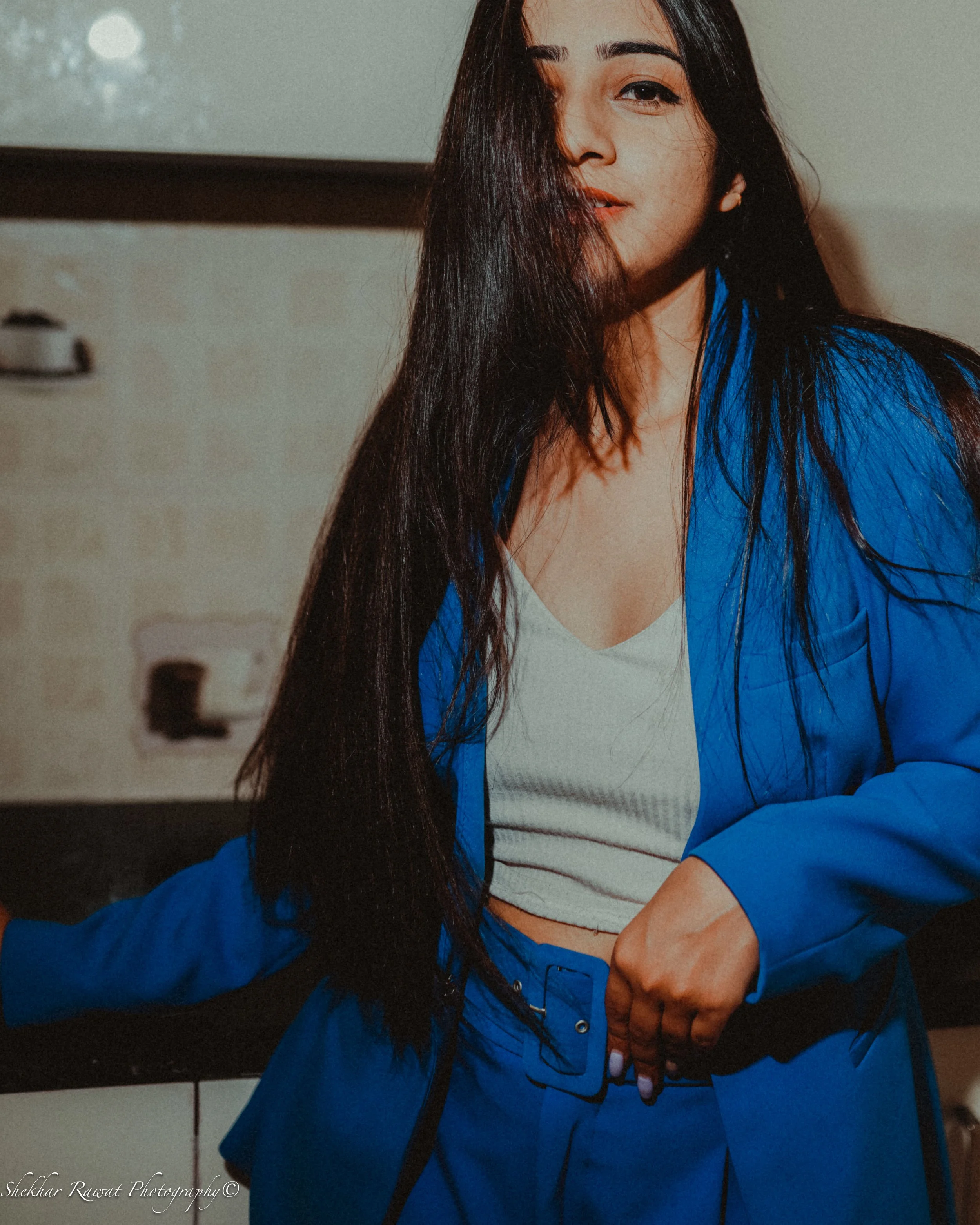 Model in a white top and blue jacket, editorial fashion photography in Melbourne by Shekhar Rawat