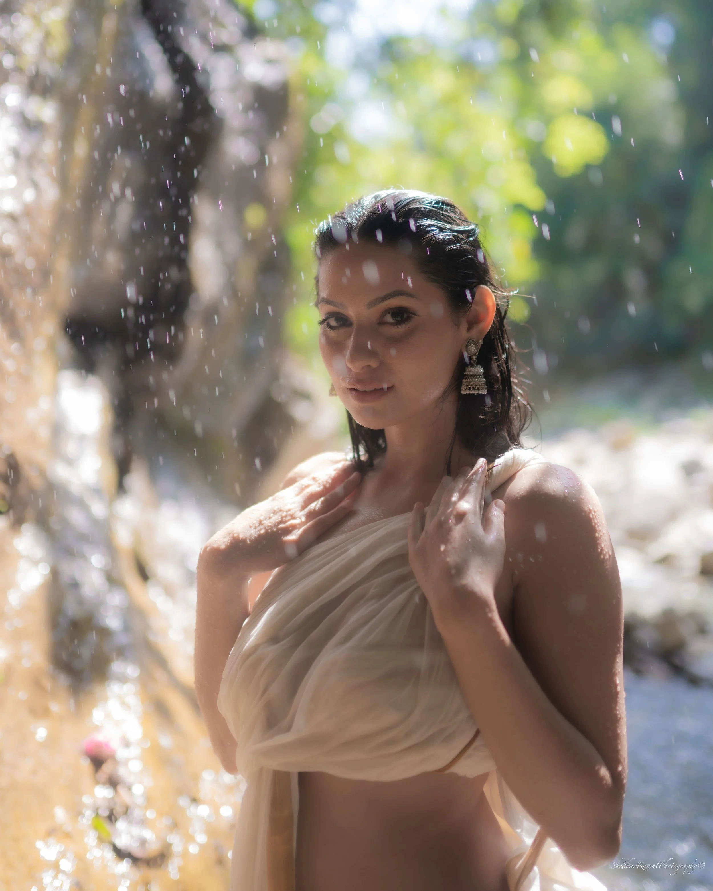 Model in a draped garment standing in sunlit water, conceptual portrait by Melbourne photographer Shekhar Rawat