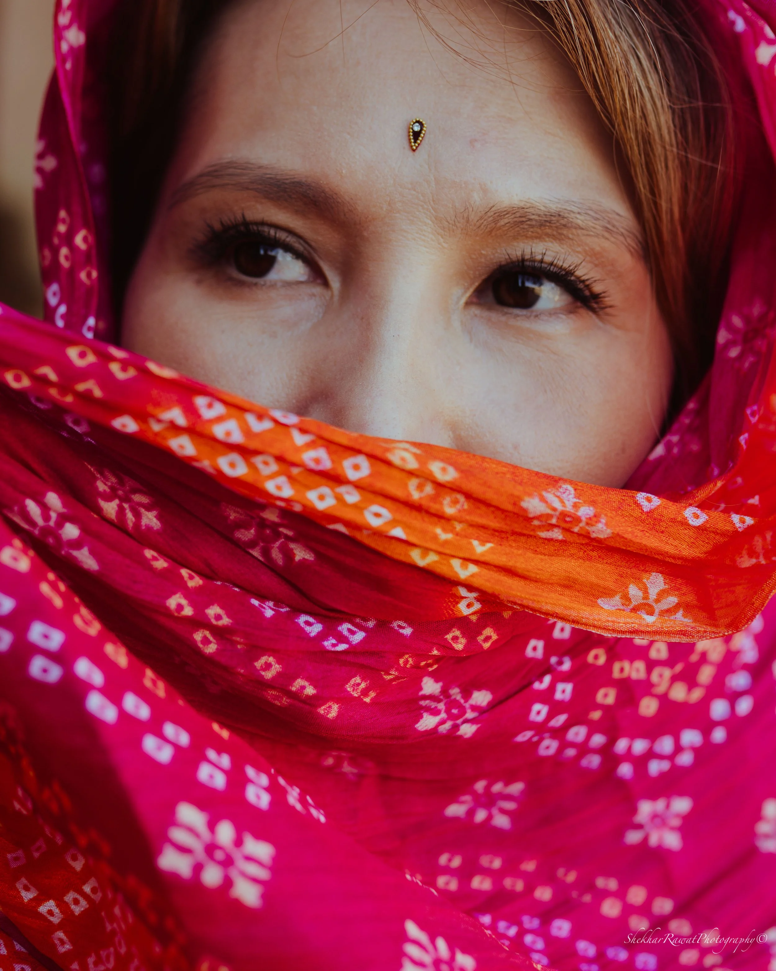 Eyes framed by a colourful patterned scarf, artistic portrait by Melbourne photographer Shekhar Rawat