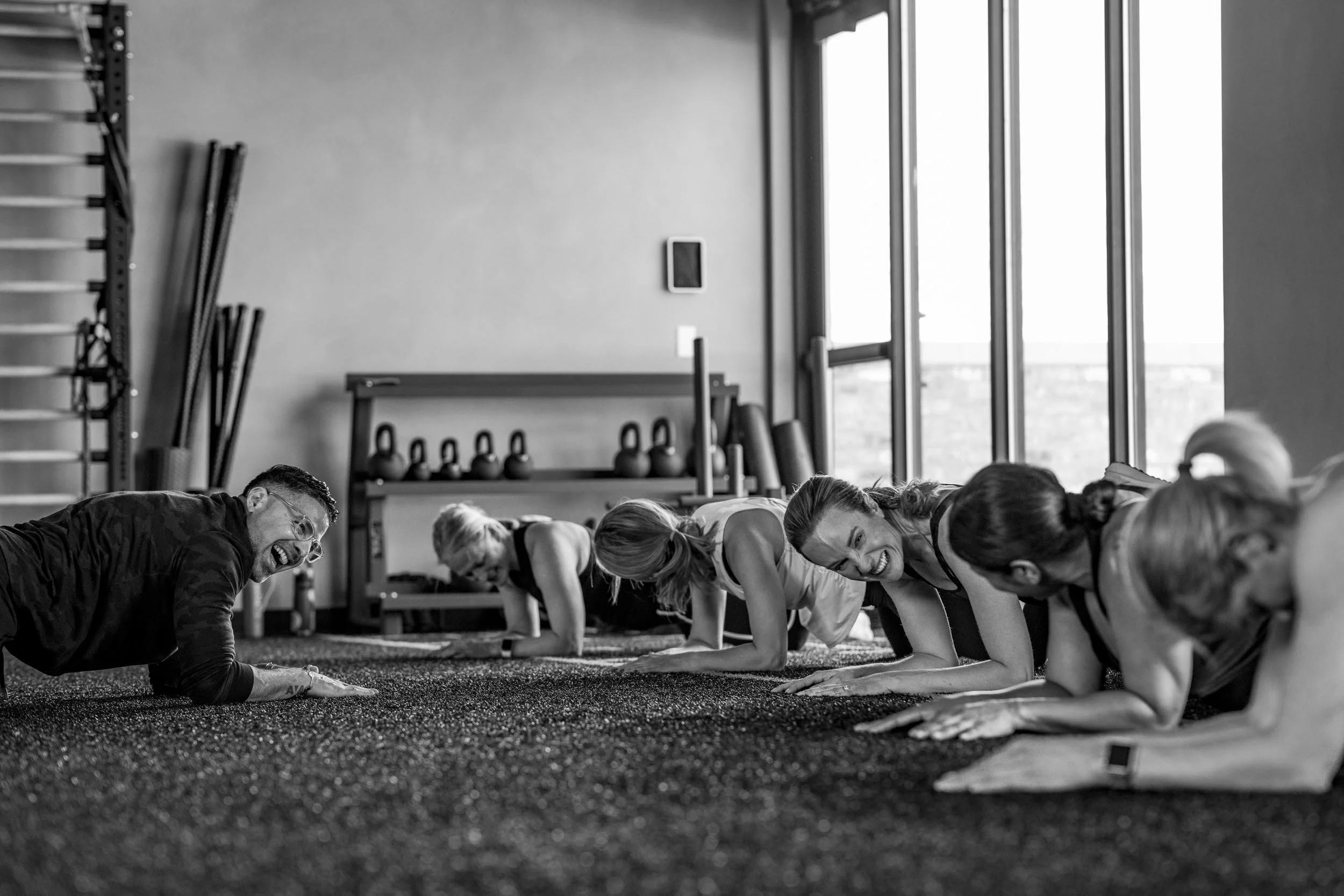 Group yoga class with participants stretching