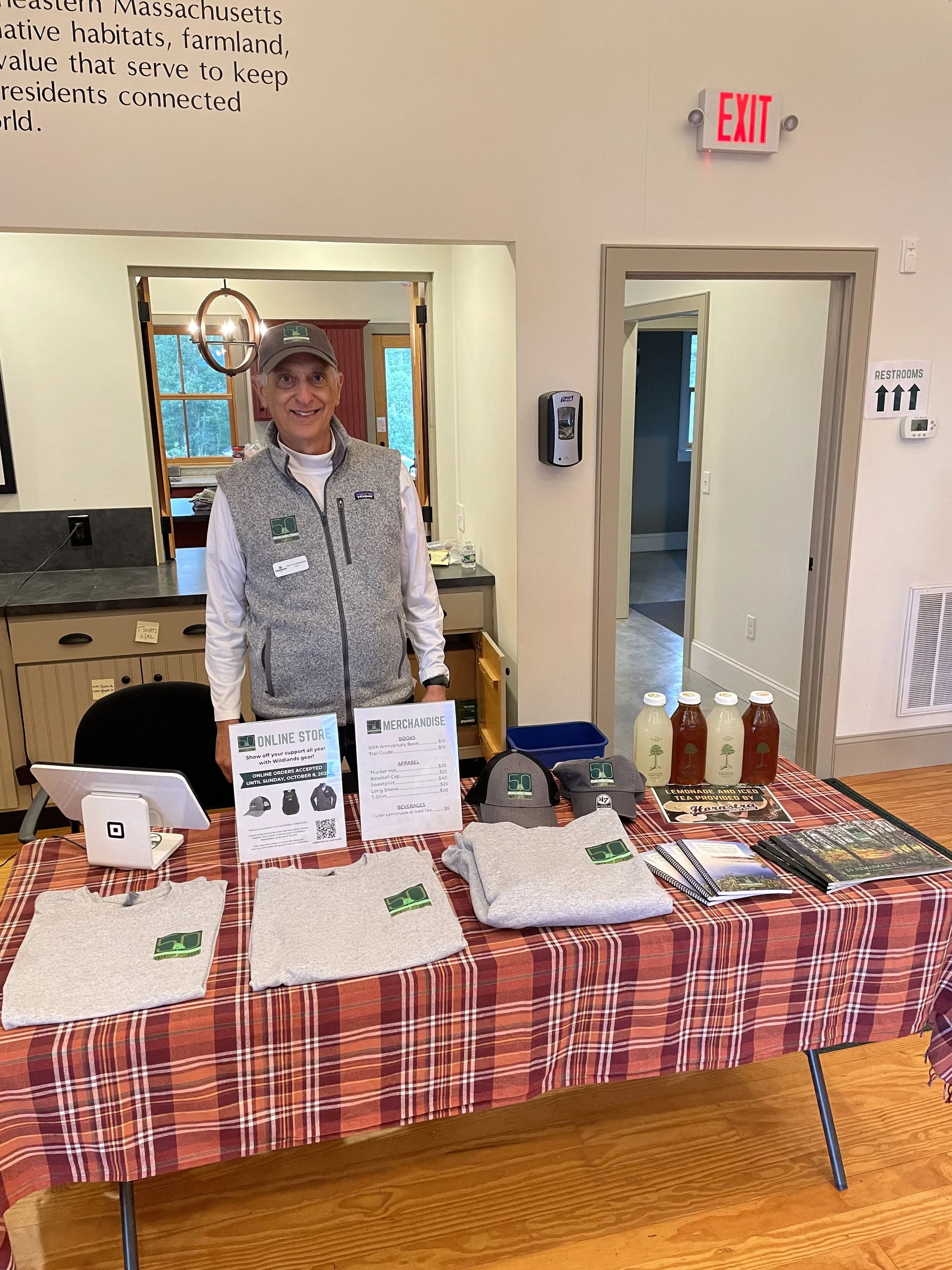 Wildlands Office Manager Tom D'Allessandro mans the merchandise table.