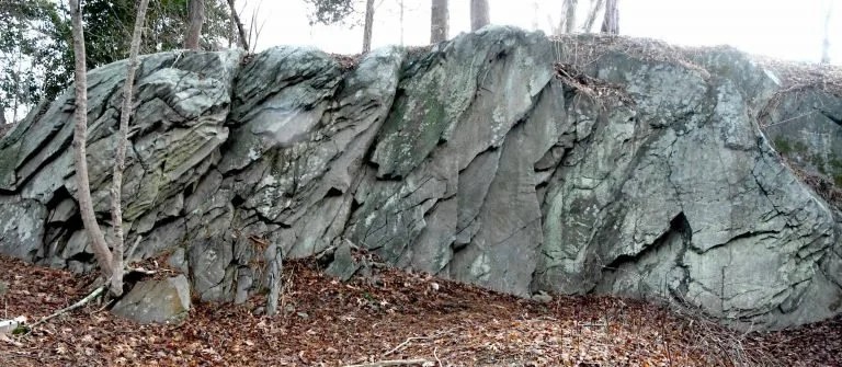 A rocky outcropping in the woods.