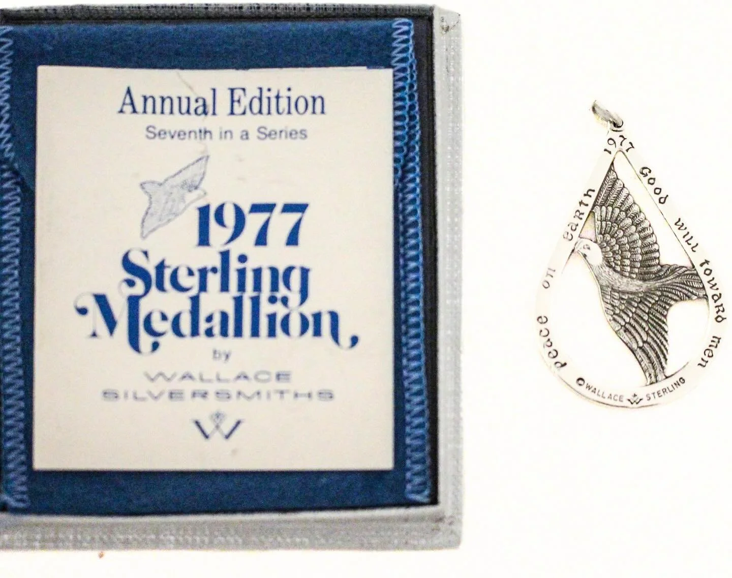 Tonight the Rockefeller Center Tree will shine&mdash;and this 1977 sterling silver dove echoes the same timeless wish: peace on earth. 
The 1977 Wallace Sterling Medallion is the seventh release in the long-running annual series produced by the renow