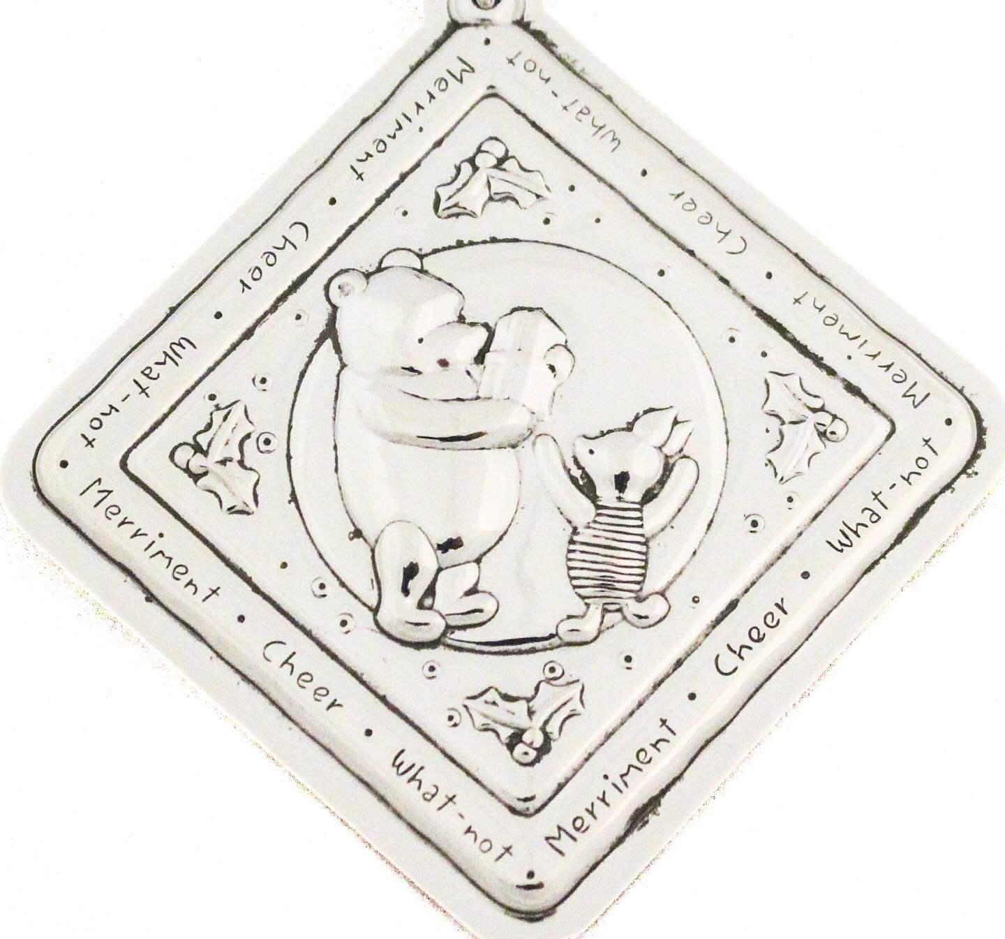 A timeless holiday keepsake ✨

This charming sterling silver Christmas ornament features a heart-warming Winnie the Pooh scene, capturing a tender moment filled with warmth, friendship, and holiday cheer. Framed with classic holly accents and playful