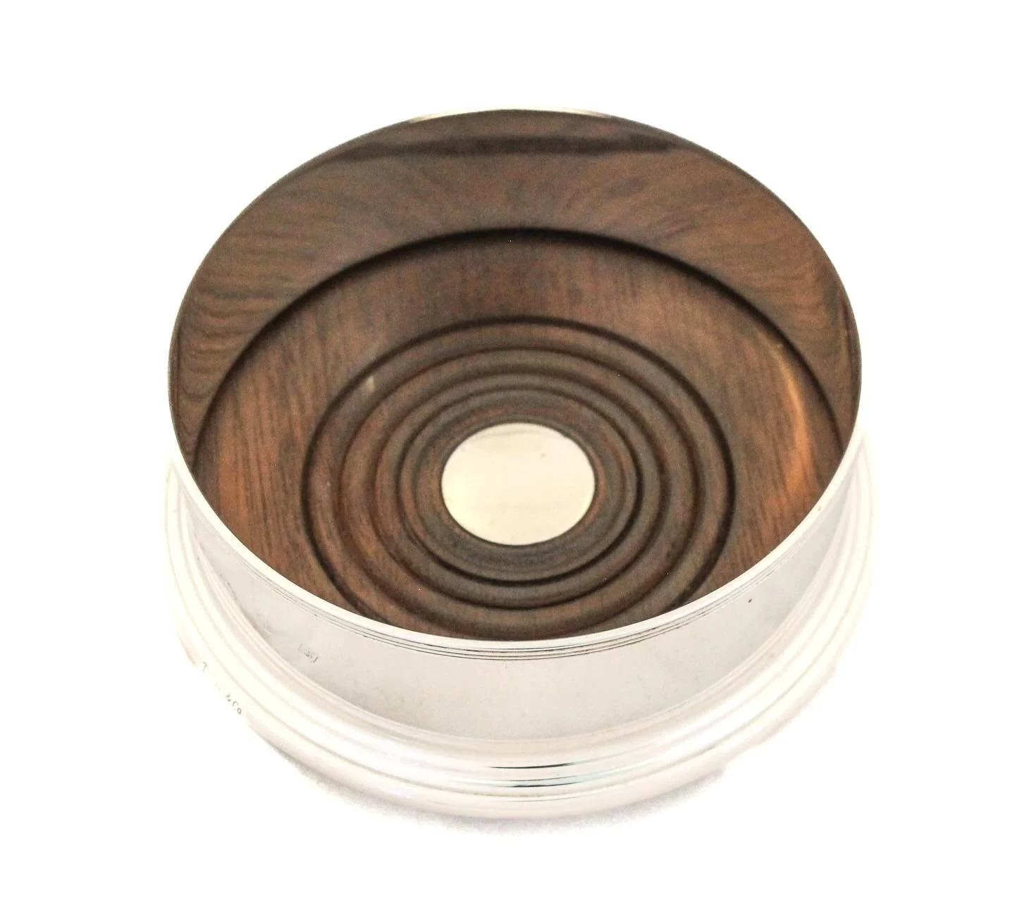 This sterling silver wine coaster by Tiffany &amp; Co. is a quietly luxurious addition to any New Year&rsquo;s celebration, designed to cradle a favorite bottle of champagne or wine with understated elegance. Resting beneath the bottle, it protects f