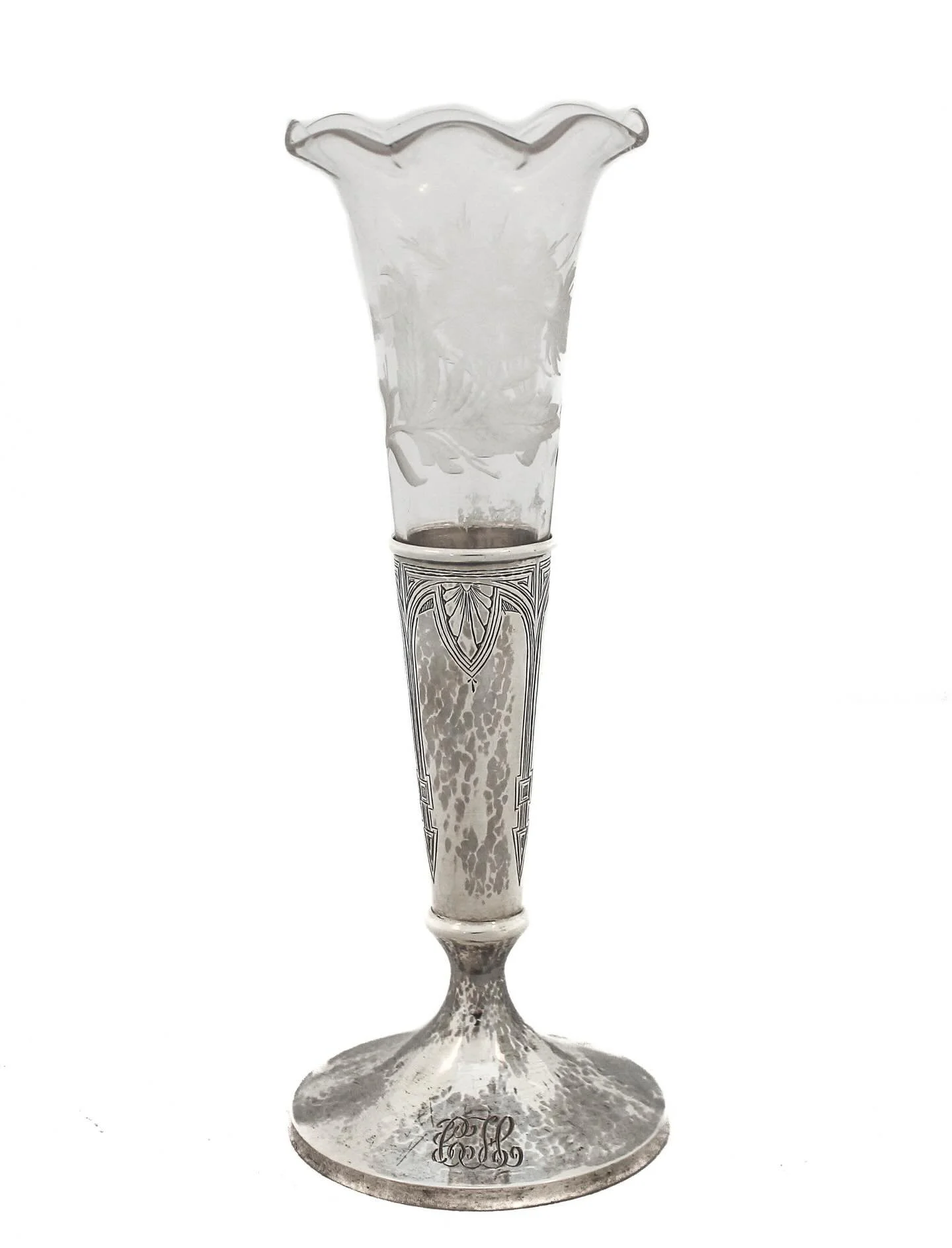 Crystal meets sterling &mdash; and the result is pure turn-of-the-century elegance.
This striking vase pairs an acid-etched crystal trumpet form with a hand-hammered sterling silver base, beautifully detailed in the Art Nouveau taste. The scalloped r
