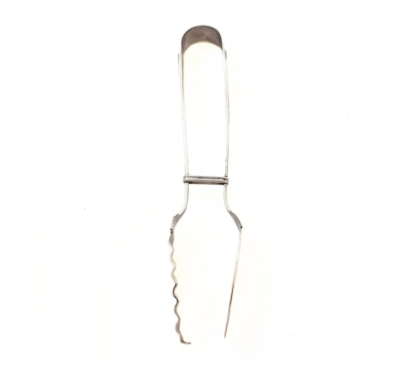 A refined and practical sterling silver serving piece, likely a combination fish server or cocktail fork with integrated corkscrew.
The handle features an elegant, tapered design with subtle linear detailing and a central collar motif, lending a rest