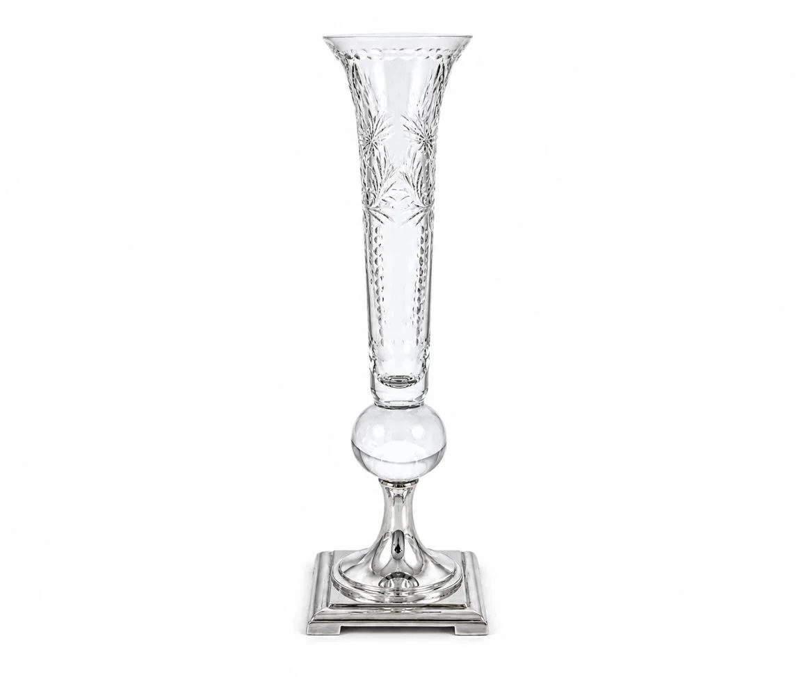 A striking marriage of brilliance and craftsmanship, this elegant crystal trumpet vase by Hawkes Glass Co. of Corning, New York rests atop a refined sterling silver base, creating a presentation that is both timeless and unmistakably sophisticated.


