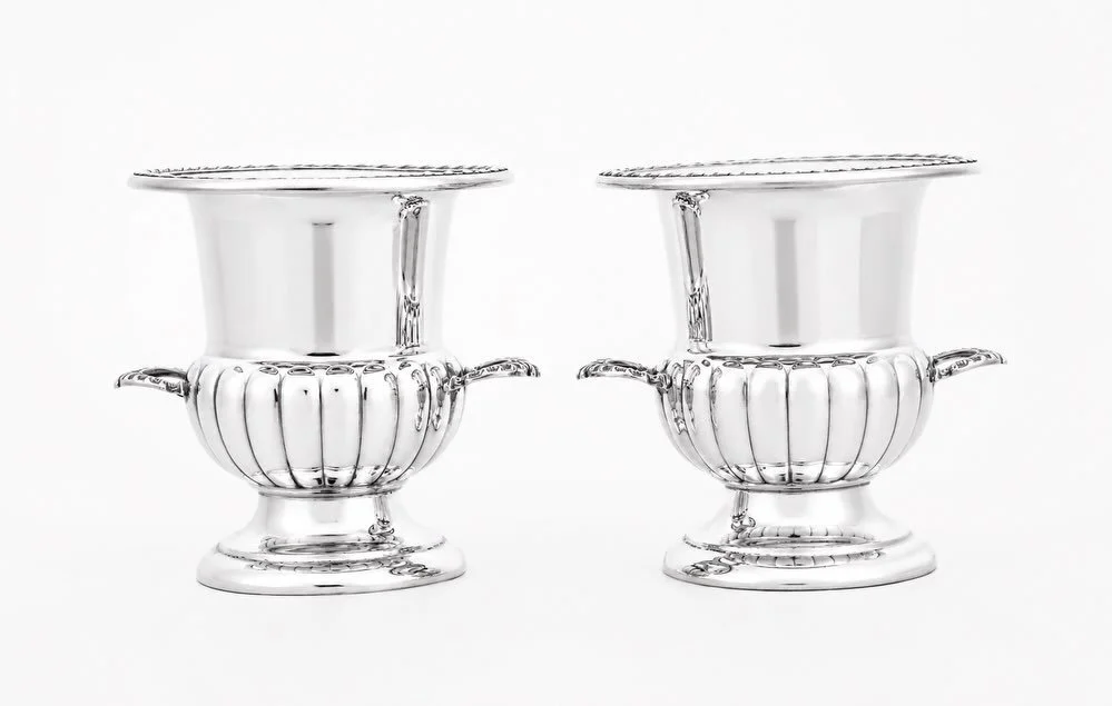 A perfect example of how even the smallest sterling silver object can make a lasting impression.

This elegant pair of urn-shaped sterling silver toothpick holders combines classical form with refined craftsmanship &mdash; featuring fluted bodies, de