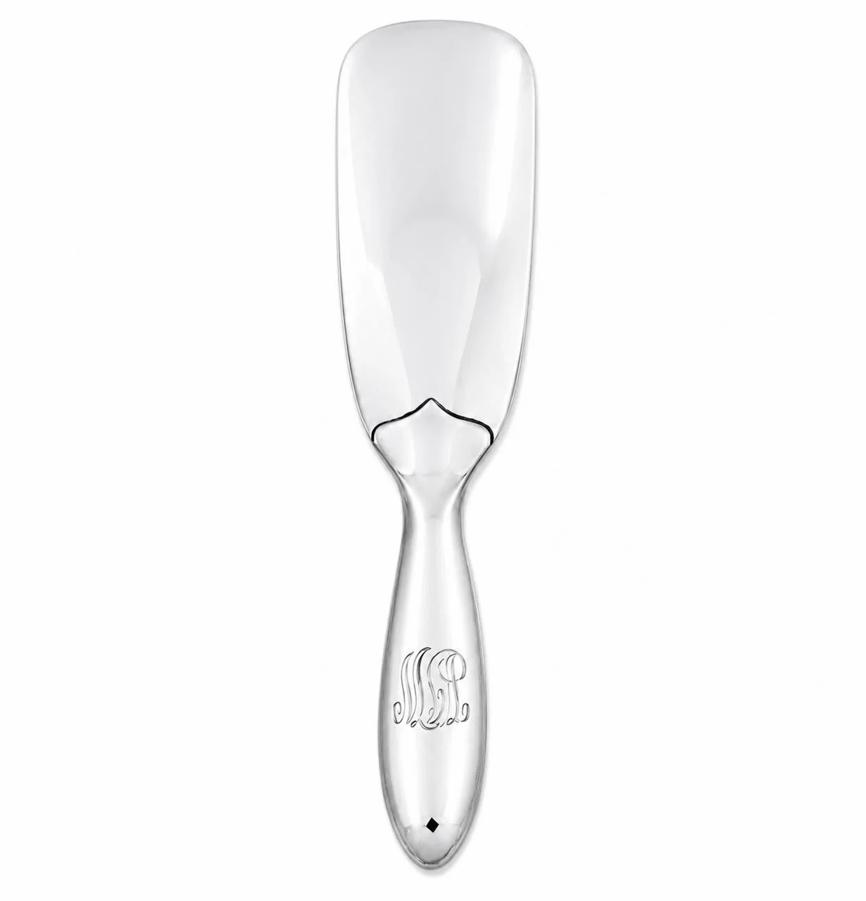 A study in understated elegance.
This sterling silver shoehorn by Tiffany &amp; Co. transforms an everyday object into something refined, substantial, and timeless. Its sleek sculptural form is accented by a beautifully engraved monogram, while the m