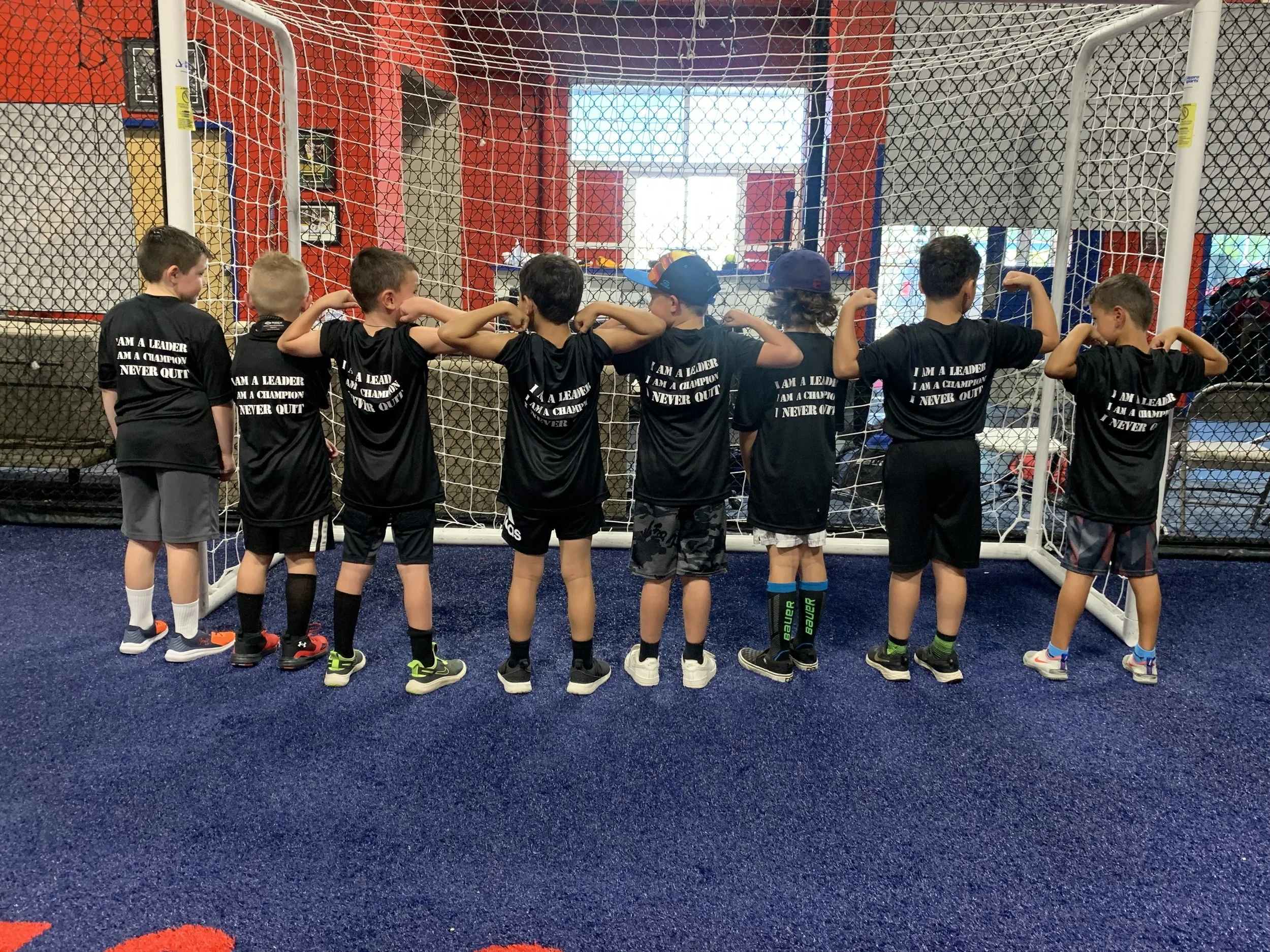 Young boys in black sports shirts with 