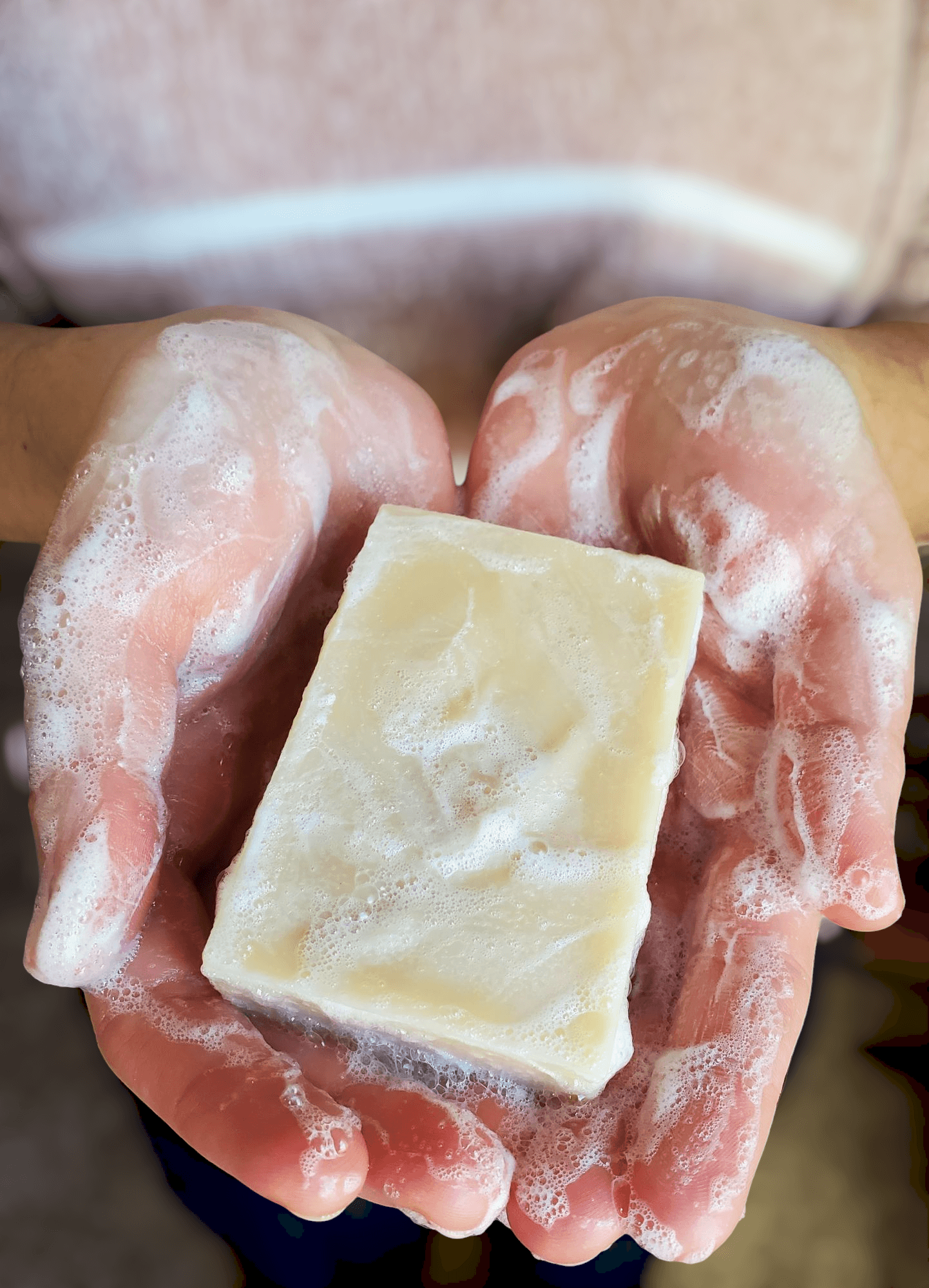 bubbly goat milk soap washing hands