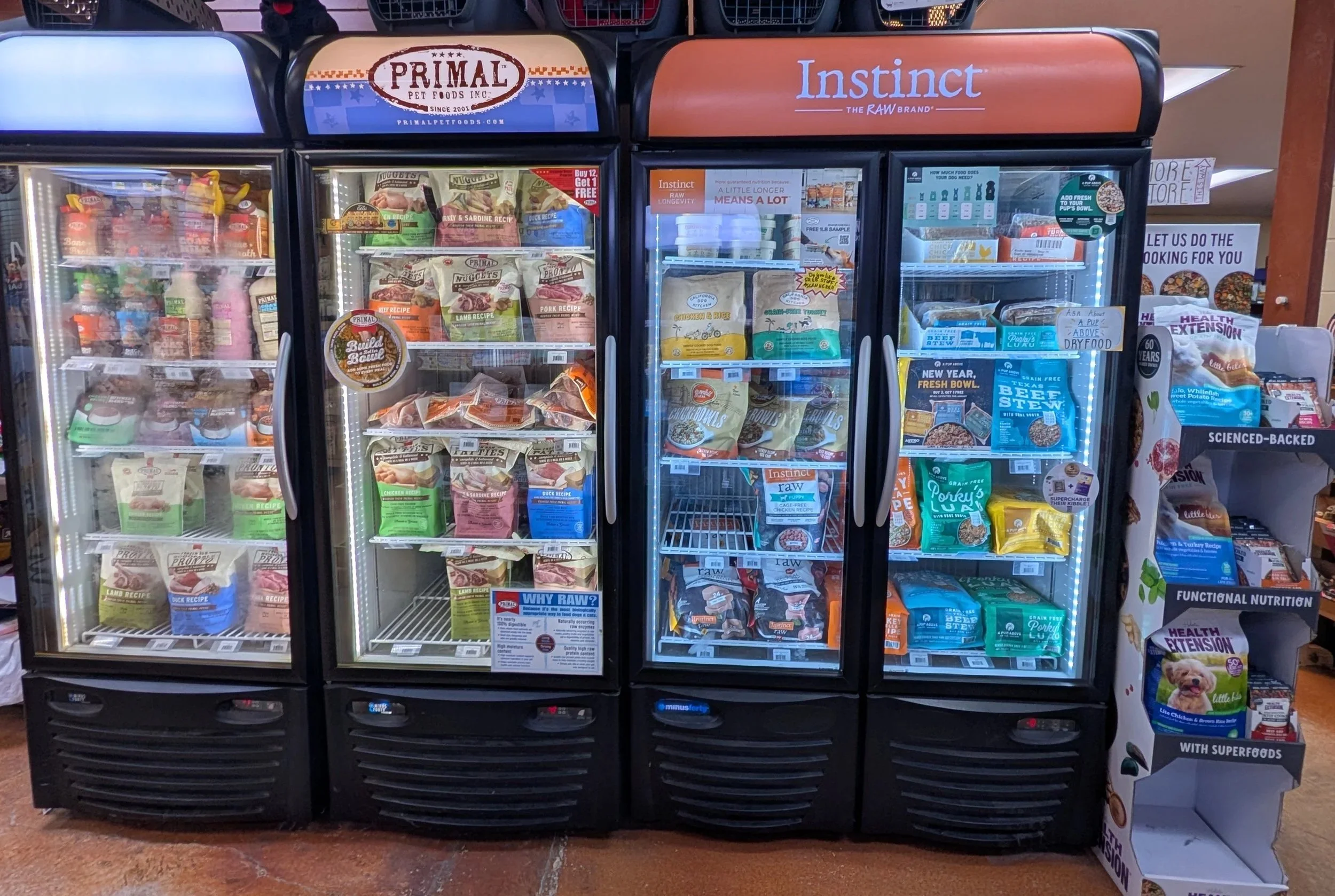 Portland Pet Supply Primal, Instict, California Dog Kitchen and a Pup Above frozen dog food