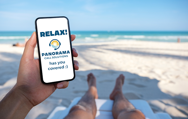 Beach-goer looking at cell phone that is being answered by Panorama Call Solutions service.