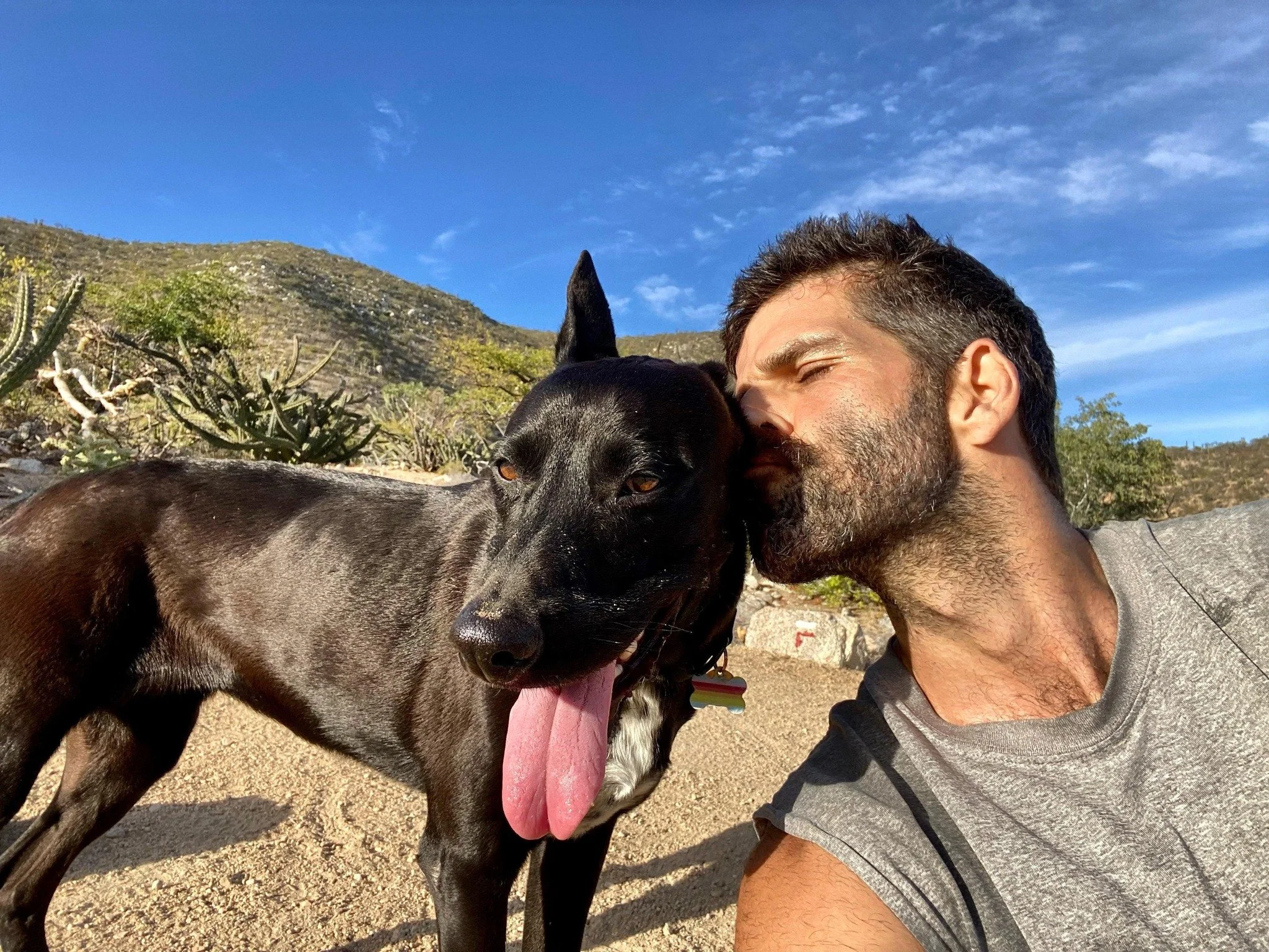 Yago Doson, Marine Biologist and Fisheries Scientist, Founder of Monkeys of the Sea. Picture taken in 2023  in El Sargento, Baja California Sur,  with his beloved dog Relampago.