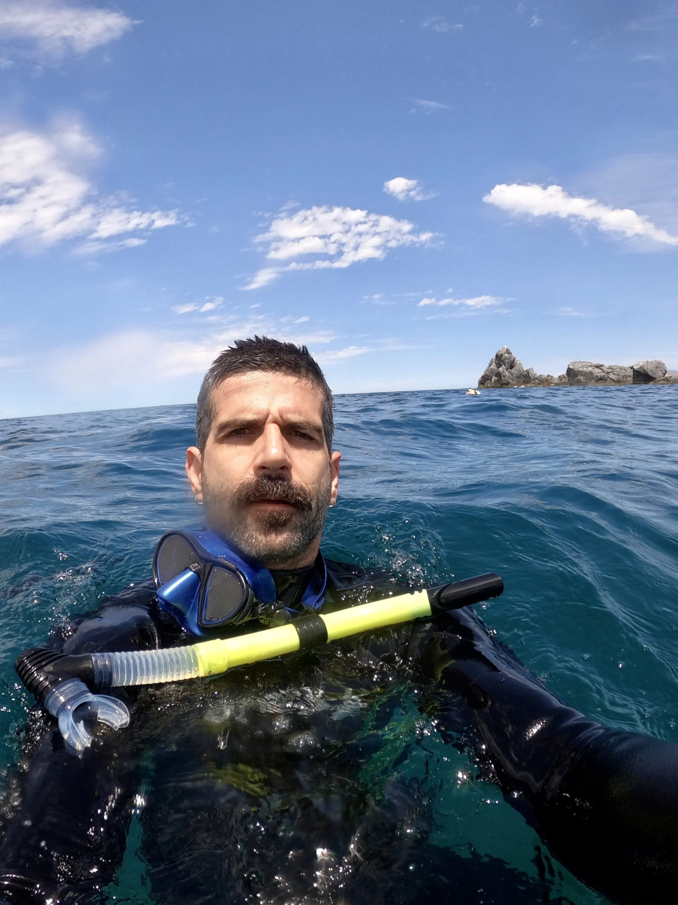 Yago, Monkeys of the Sea Founder and Expedition Leader, snorkelling at the rock formation in El Saltito / Playa Muertitos, La Paz, Baja California Sur.