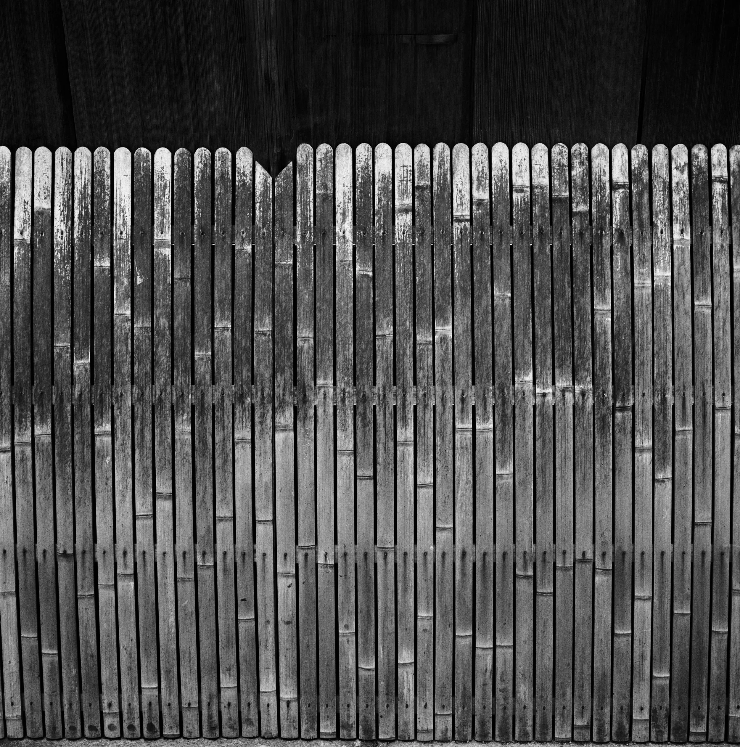 detail of inu-yarai, bamboo guards for walls along the street, old house in Gion, Kyoto, JAPAN