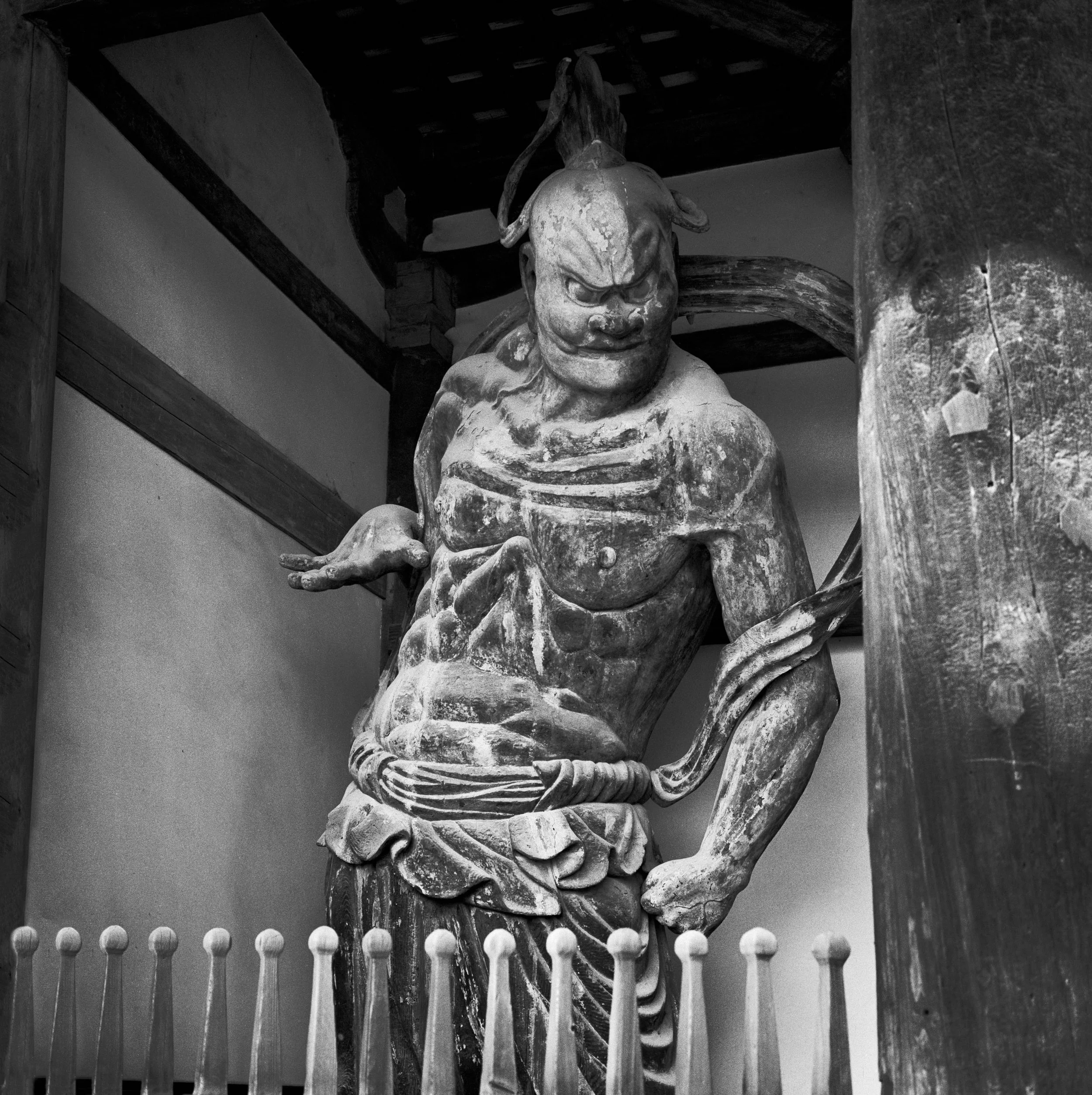 Nio guardian at entry gate to 8th century Horyuji Temple, near Nara, Japan