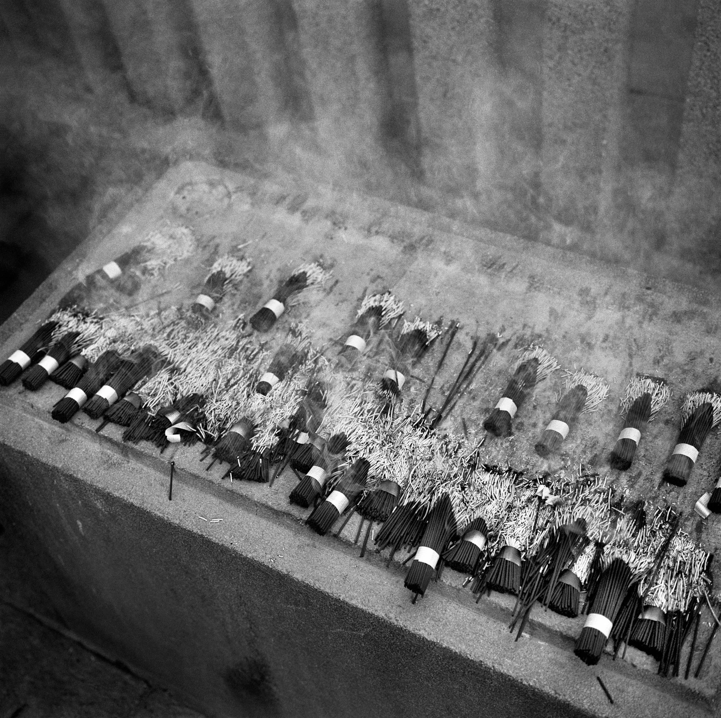 incense burning at Sengaku-ji temple, Tokyo, JAPAN