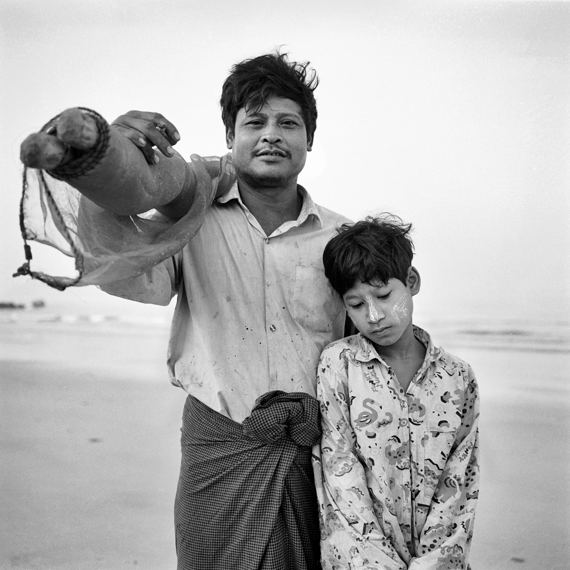 Fisherman and his daughter, Napali Beach