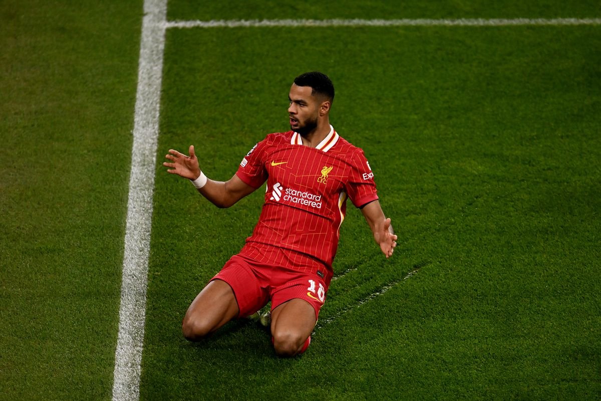 Soccer player in red jersey celebrating on the field