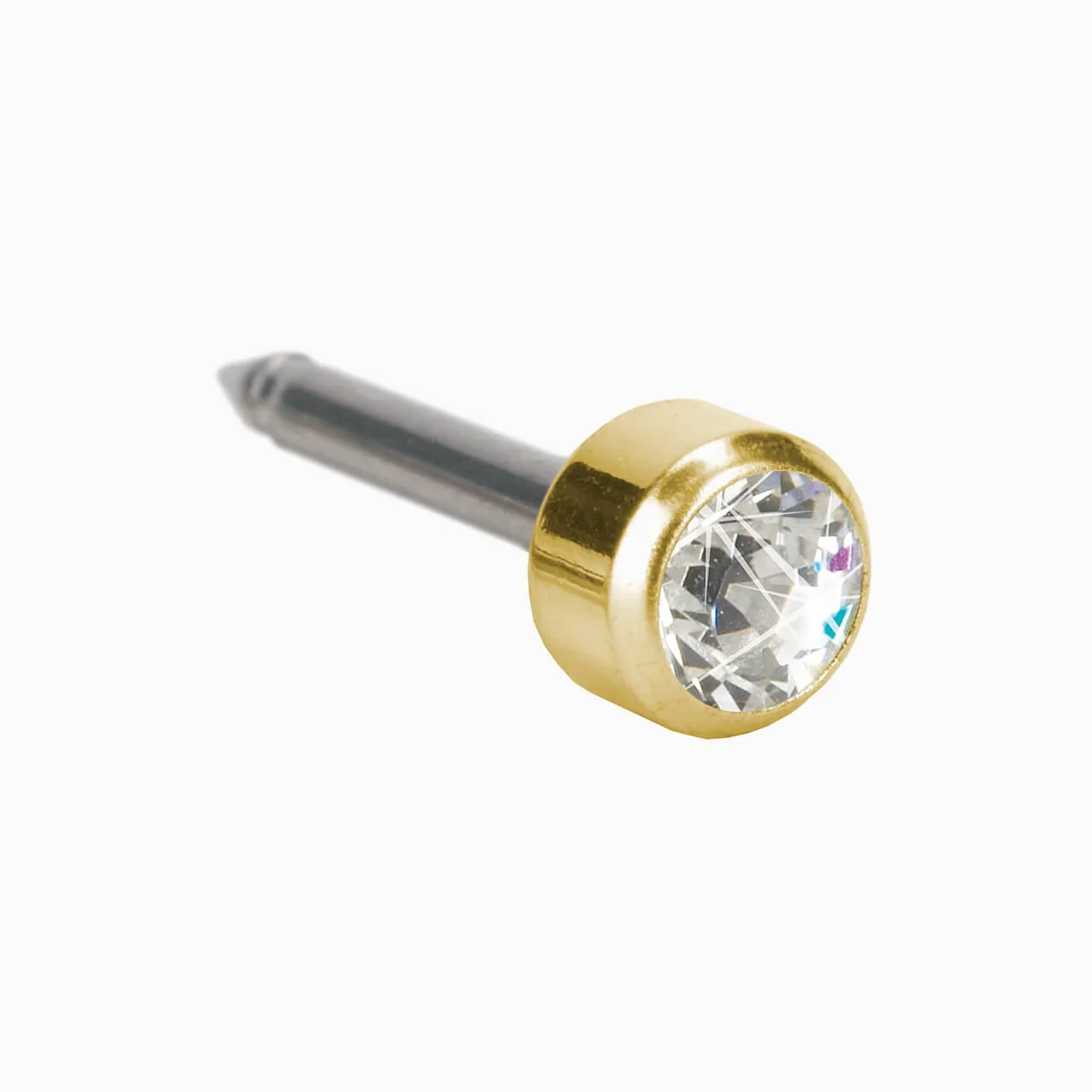 Close-up of a metallic stud earring with a round clear gemstone, gold bezel setting, and silver post, isolated on white background.