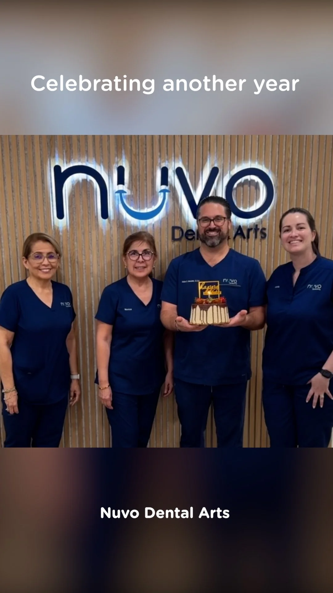 The Nuvo Dental Arts team in Miami celebrating 4 years of serving patients in Coral Gables and Coconut Grove with cake, candles, and team smiles.