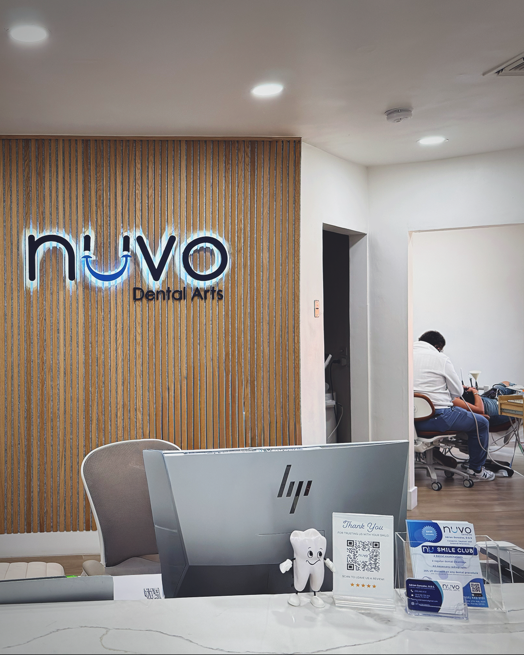 Dentist performing treatment at Nuvo Dental Arts in Coral Gables Miami with focus on precision and patient care
