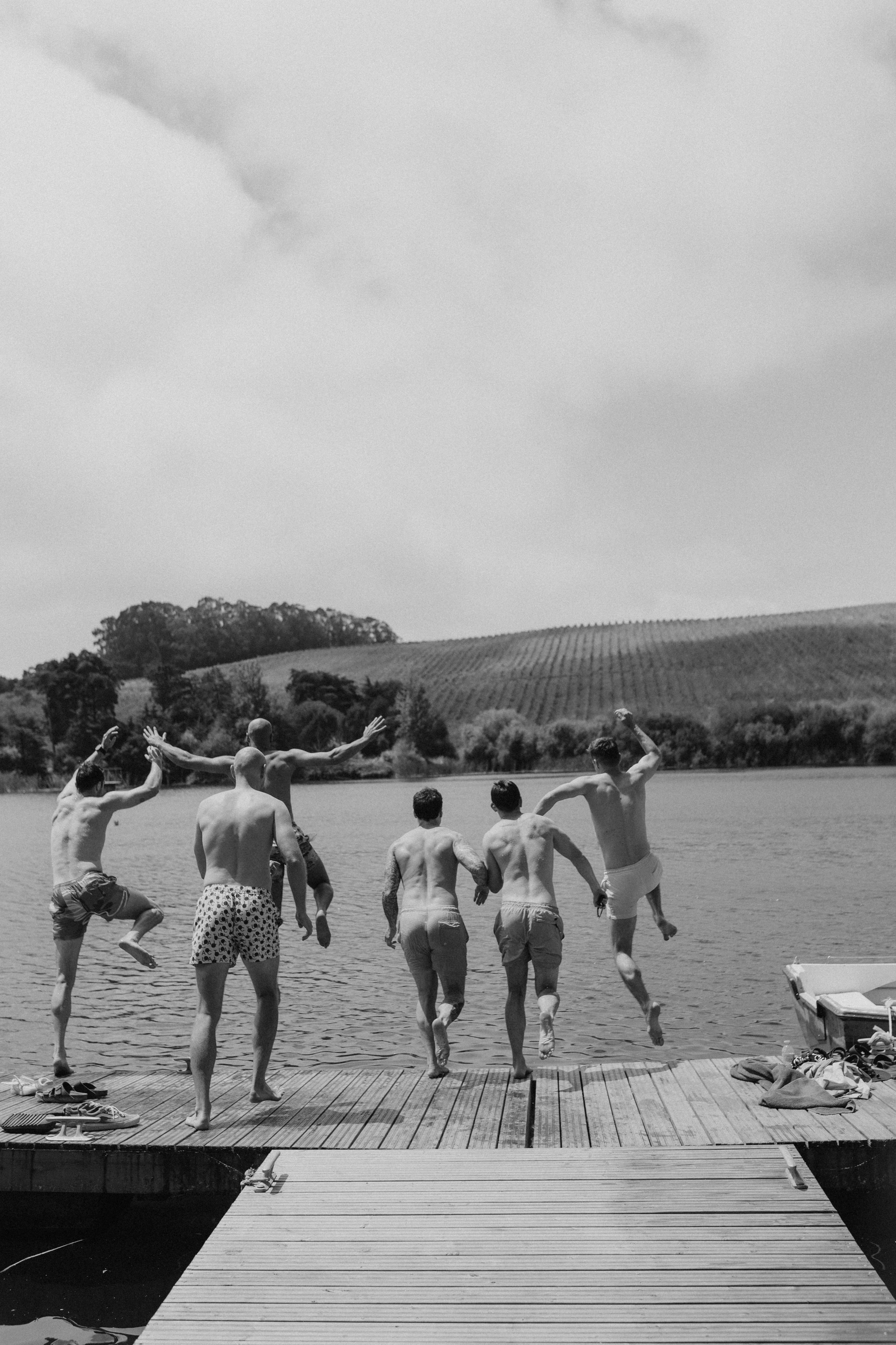 Groom prep at the lake in Portugal. Black and white.