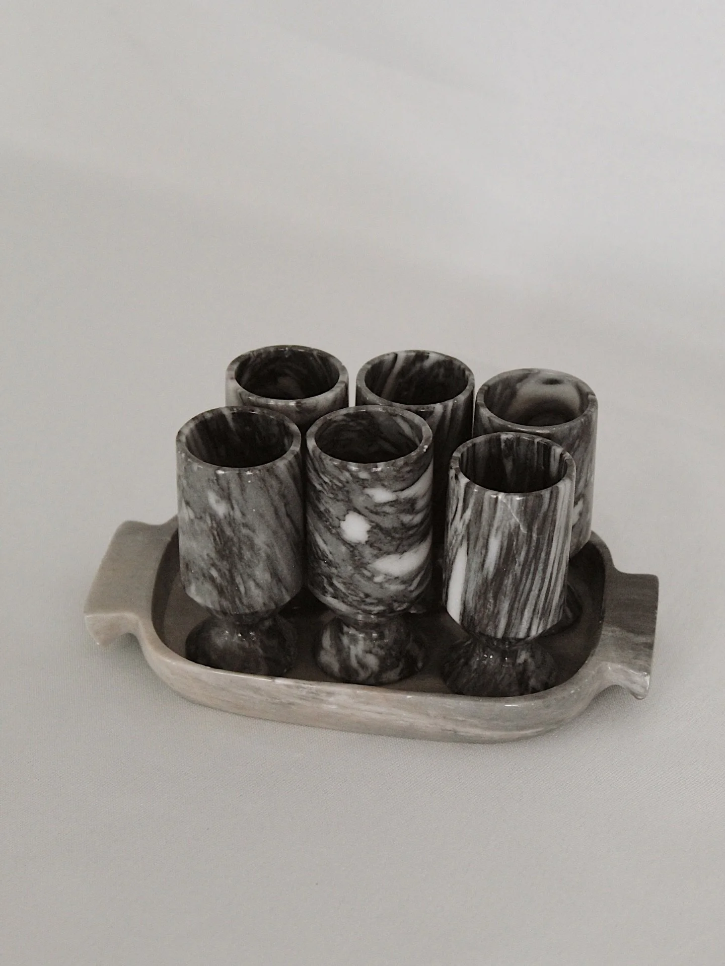 Set of six marble shot glasses with a matching marble tray. Tray is 6.5&rdquo; long and glasses are each 3&rdquo; tall. Two of the glasses have small chips in the base- see photos.
$42

Please head to CheckmateHomeInteriors.com to purchase by clickin