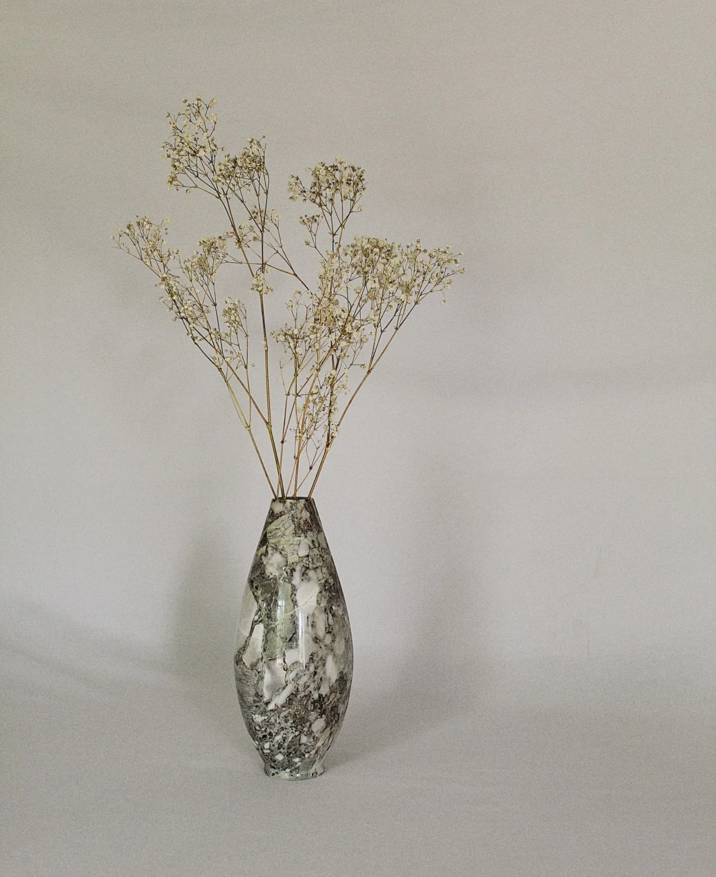 This vintage stone vase is a piece of art all on its own. Timeless, versatile, and designed to bring depth to any space. Style it with fresh stems, dried branches, or let it stand alone as a sculptural moment. Available now at CheckmateHomeInteriors.