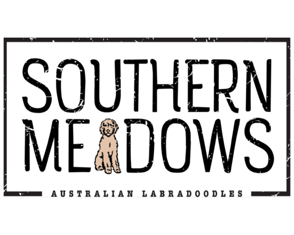 Sign reading 'Southern Meadows Australian Labradoodles' with a cartoon image of a Labradoodle dog in the center.