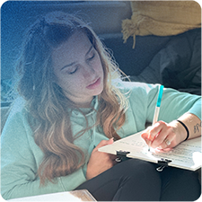 Women writing creative thoughts on paper.