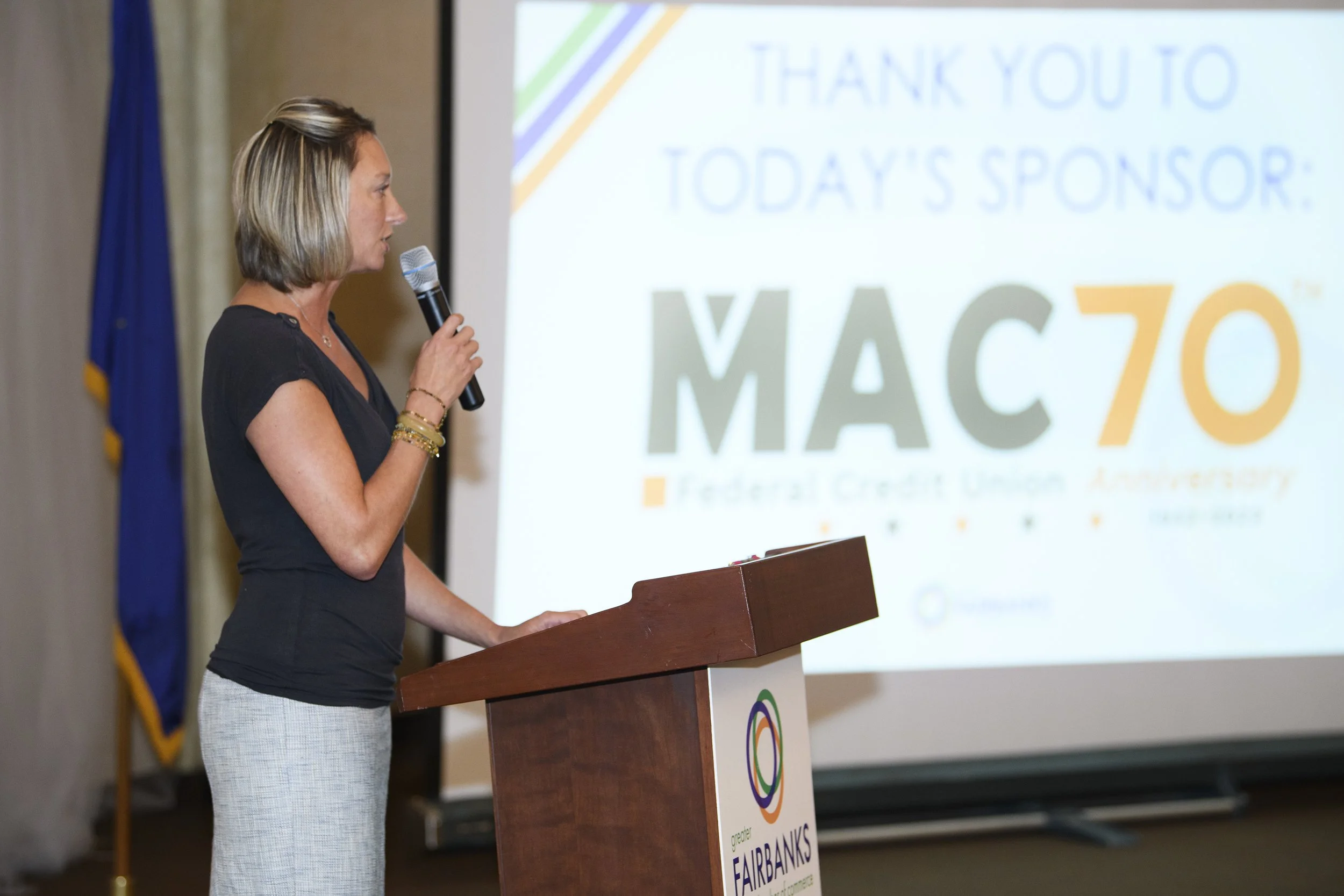 Jennifer Thompson speaking at a MAC70 event.