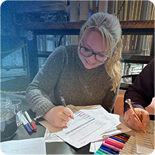 Woman smiling and writing with confidence