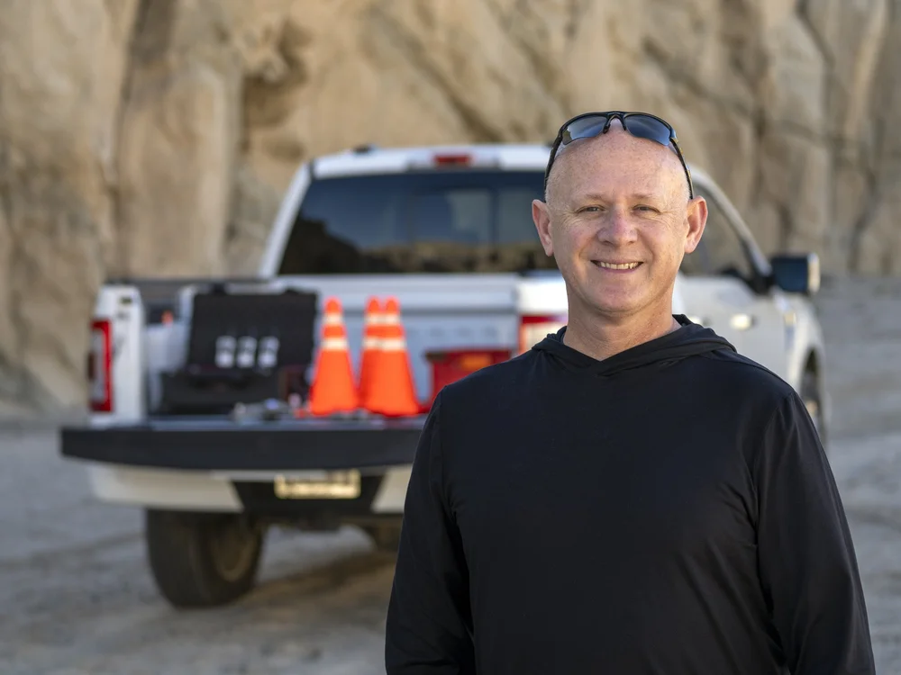 James, FAA Part 107 licensed and MSHA-trained drone pilot and GIS specialist behind CVUAS, beside his work truck