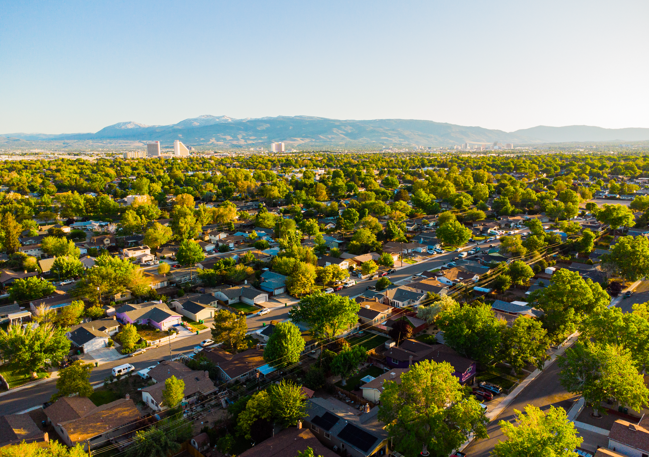 An aerial photo of Sparks, Ward 2, facing Southwest at sunset. In the distance is the Nugget hotel and casino, the Grand Sierra Resort, and the downtown Reno skyline.