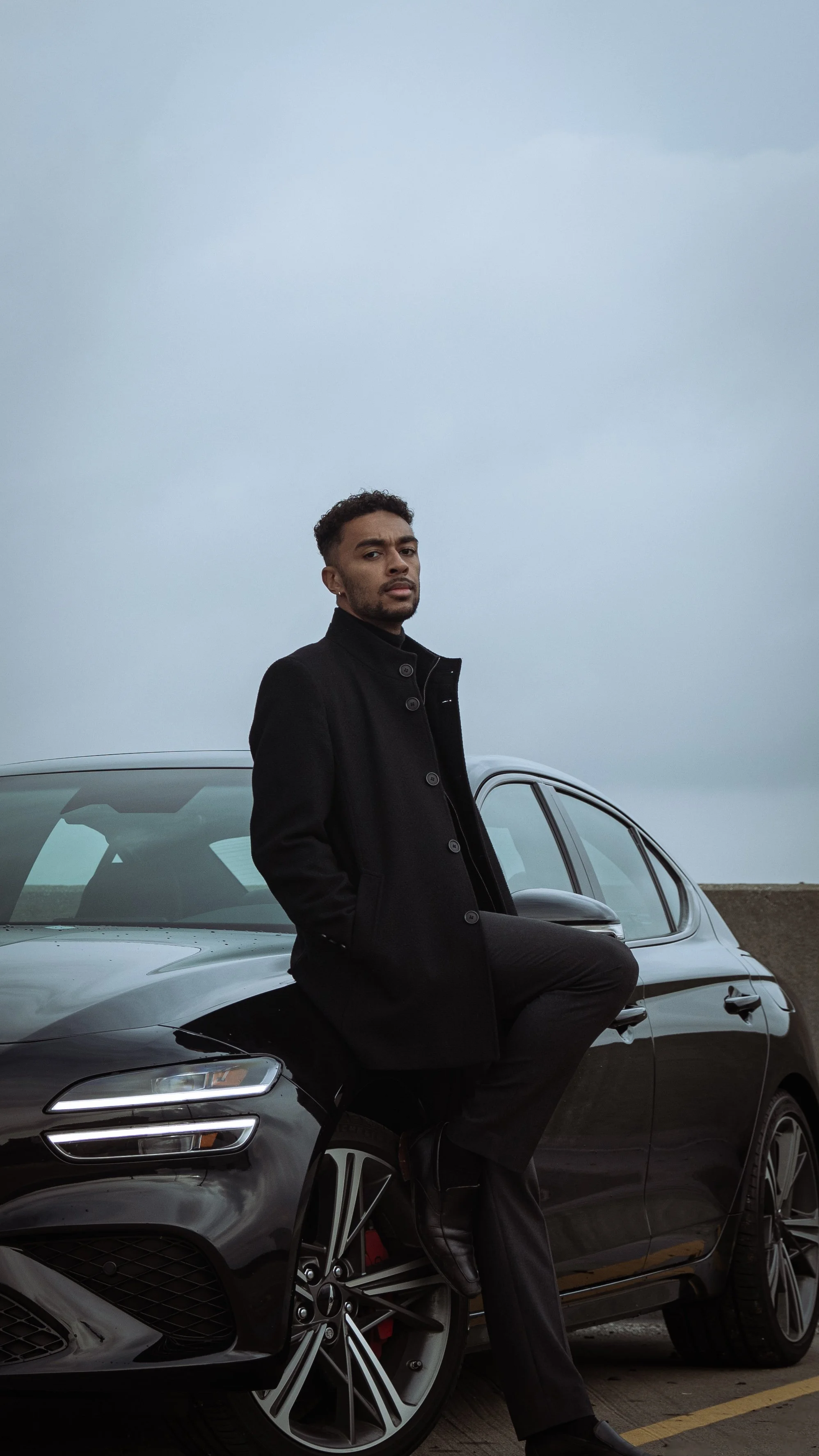 TreShon himself leaning on his Genesis G70