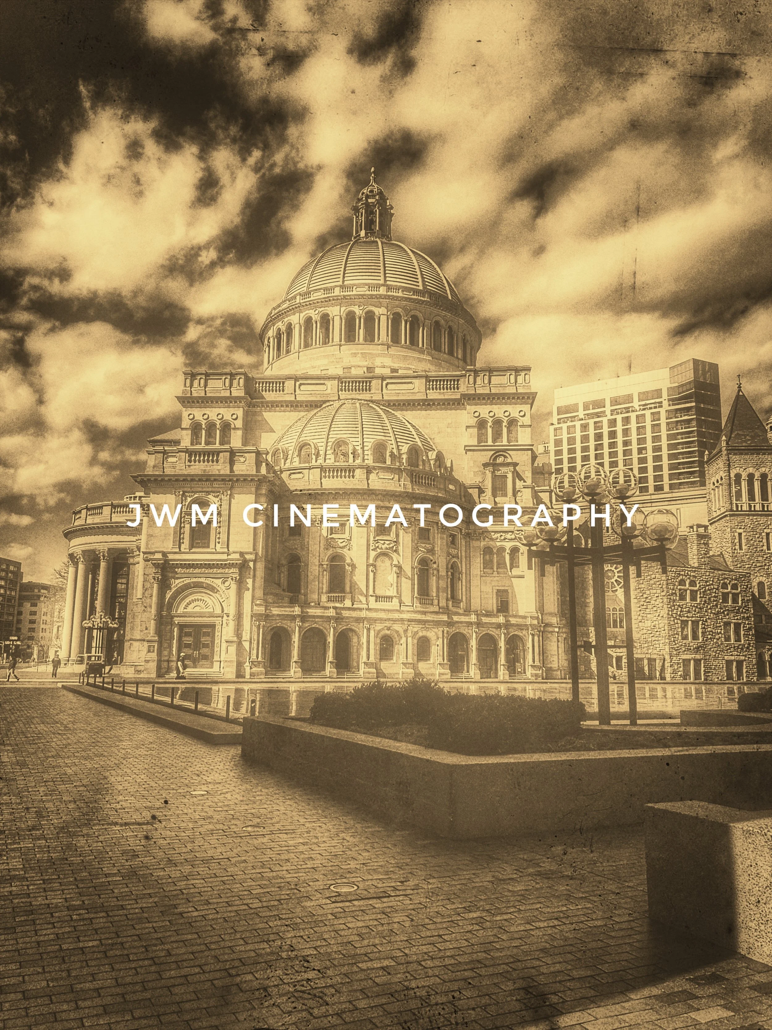 Sepia-toned image of a historic cathedral with a large dome and ornate architecture, featuring clouds in the sky. Text "JWM Cinematography" overlays the image.