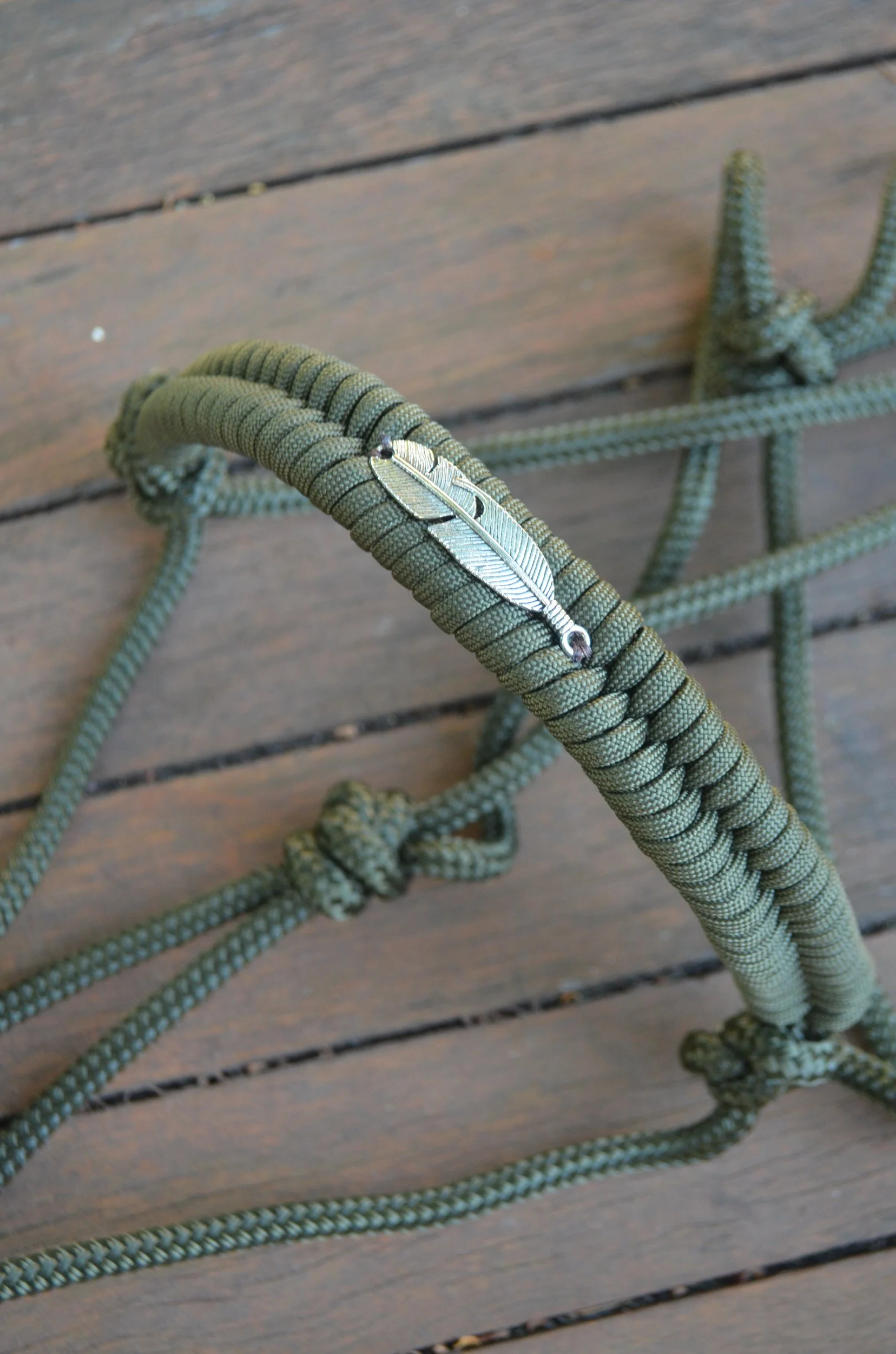 Olive green rope halter with embroidered noseband (feather charm)