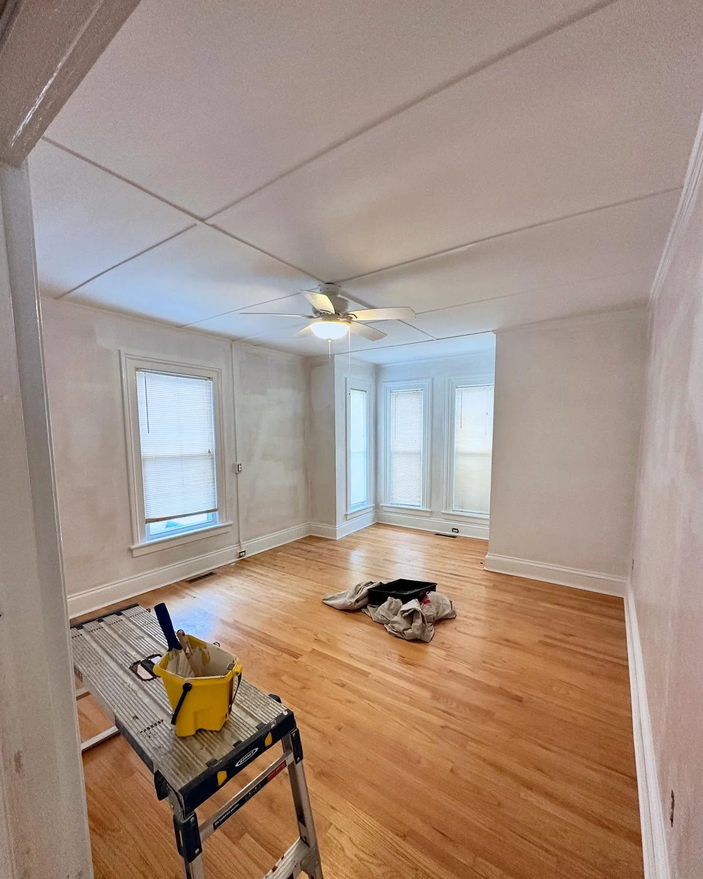 Painting and modernizing a rental property in Thomaston, CT. It&rsquo;s always amazing how much a room can improve with good quality paint (and this is just primed)!