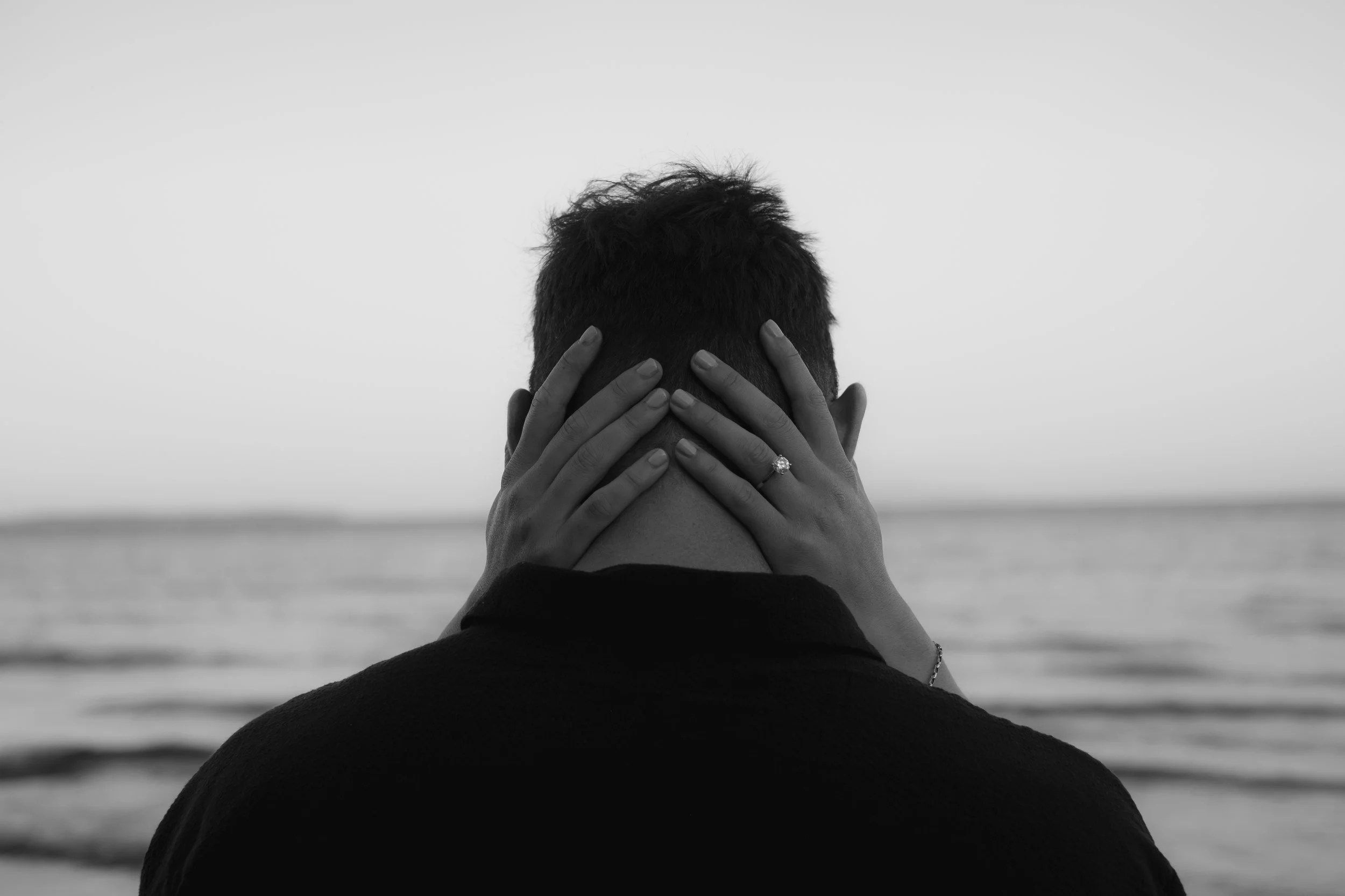 engagement session by the sea in black and white.