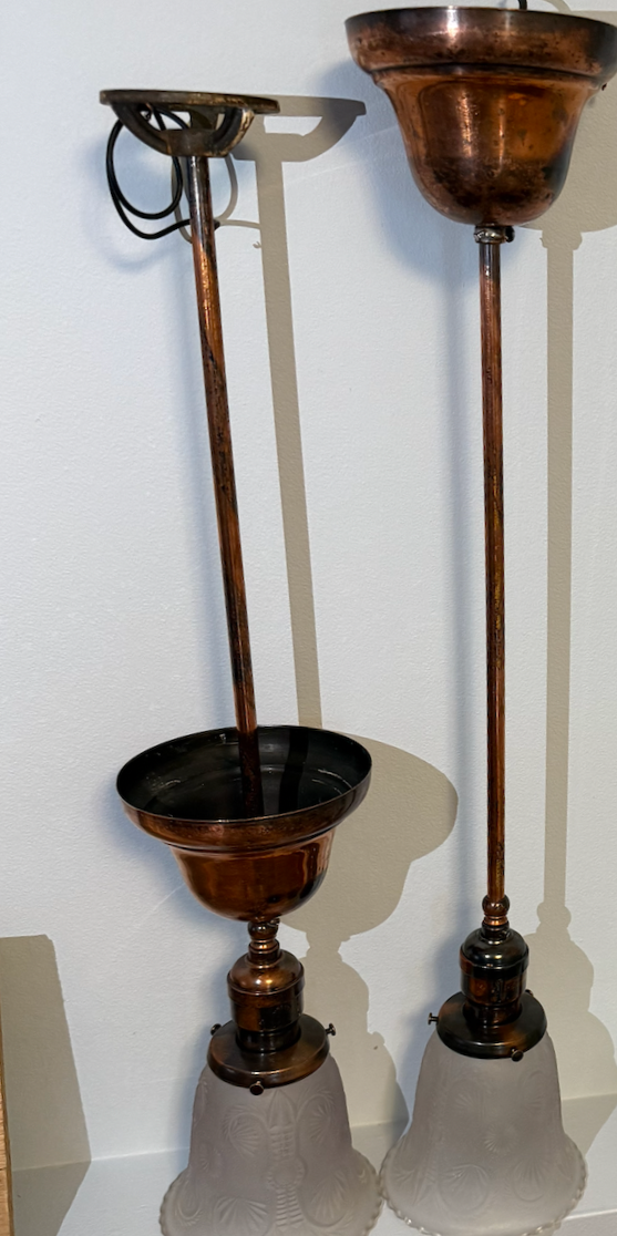 Typical of affluent St. John's homes in the early 1900s, these rigid-stem drops feature General Electric brass sockets