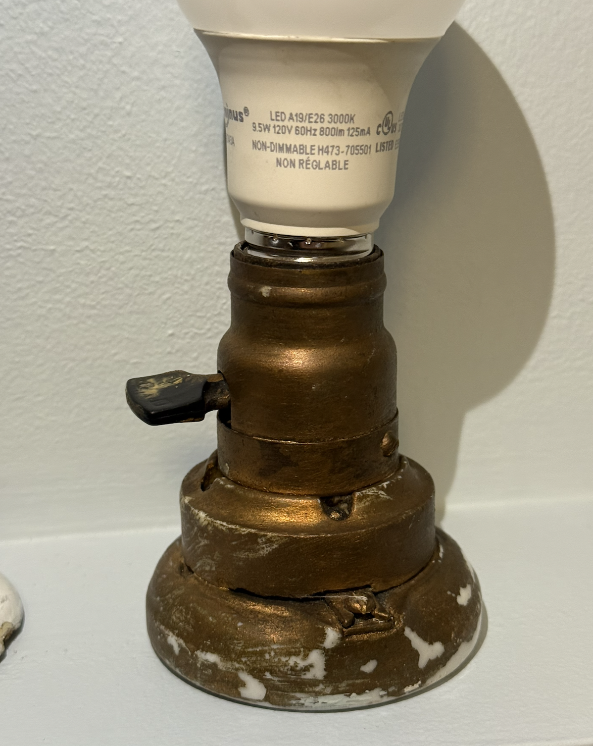 Patented in 1889, these heavy porcelain bases were designed to be screwed directly to the surface of a wall or ceiling beam