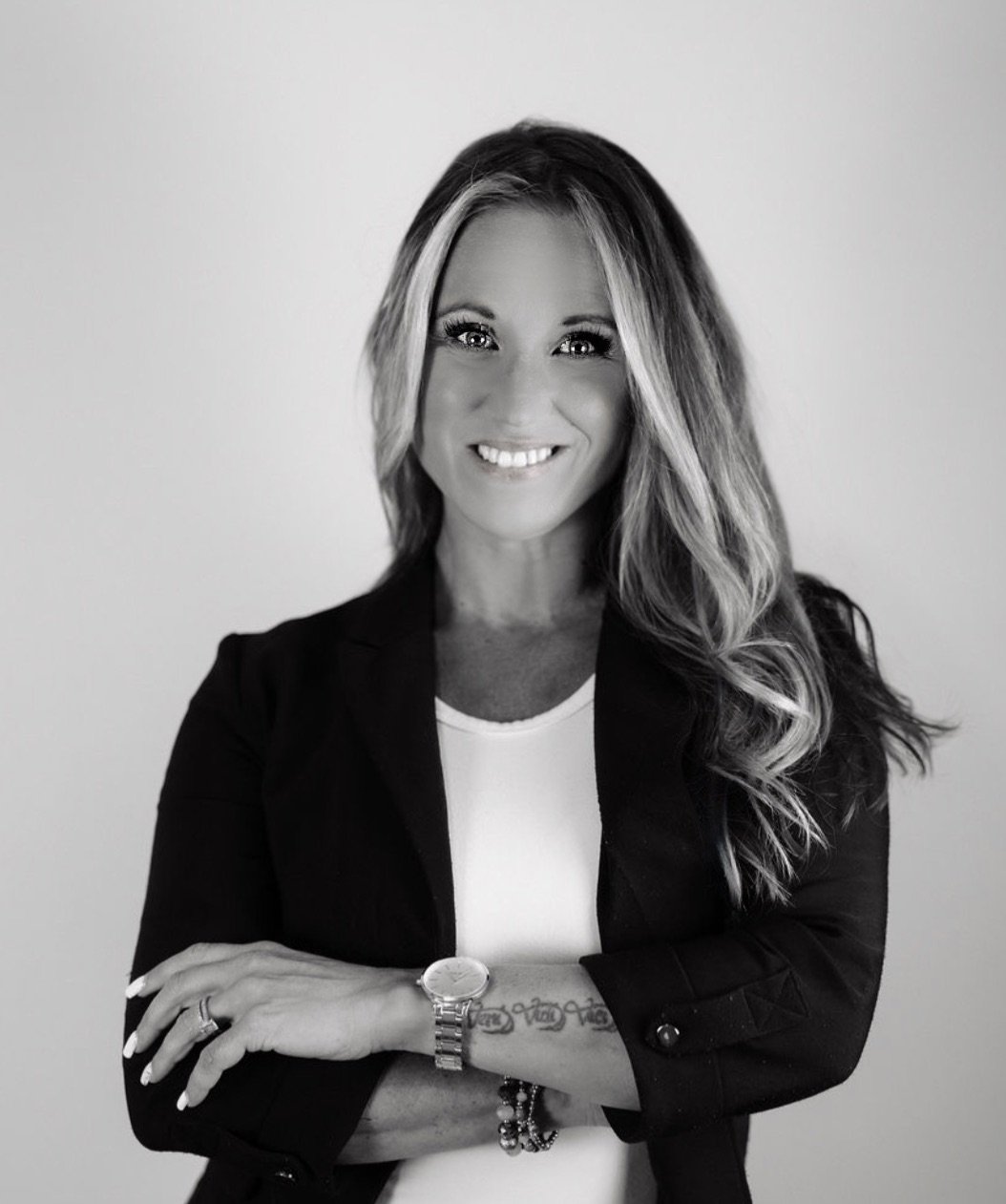 Black and white portrait of Danielle Pansera, author, speaker, and founder of Marie Luxe Collective