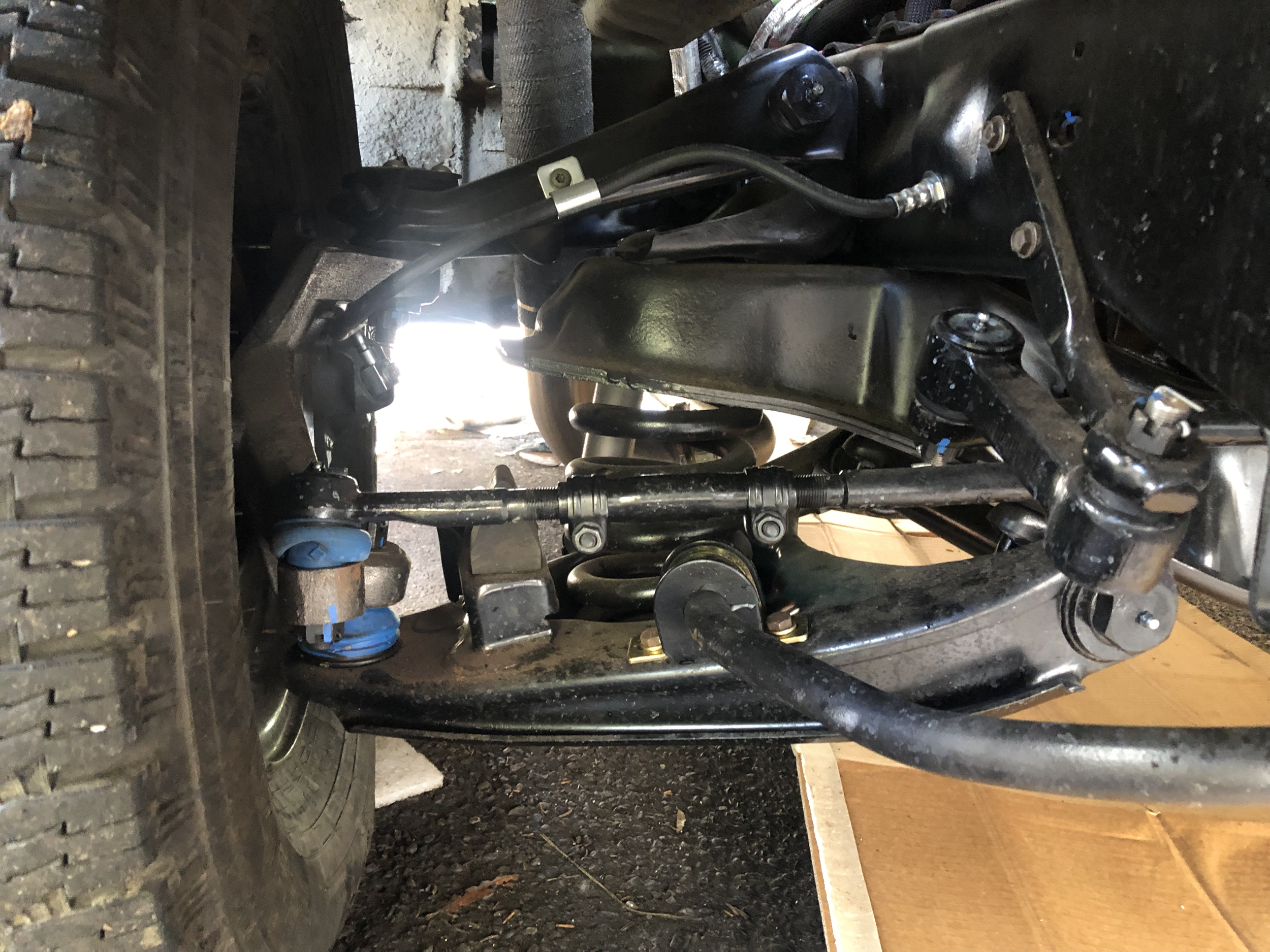 The customer requested the truck be lowered since it was a city truck. To not compromise the suspension geometry, we went with 2" drop knuckles in the front, replaced all steering components, control arms and brake components.