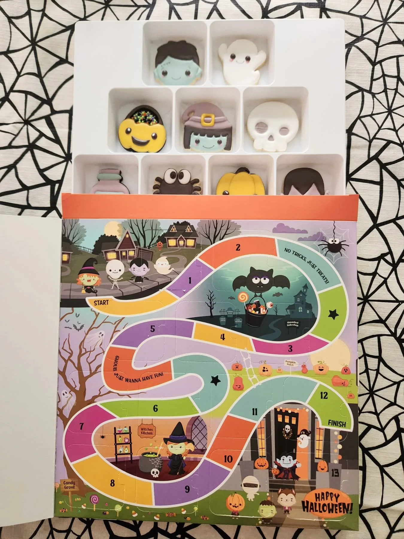 Countdown to Halloween in the sweetest way possible! Our 13 Nights of Halloween Cookie Advent Calendar is packed with deliciously spooky fun &mdash; featuring 13 hand-decorated sugar cookies, each one hiding behind its own door for a daily treat lead
