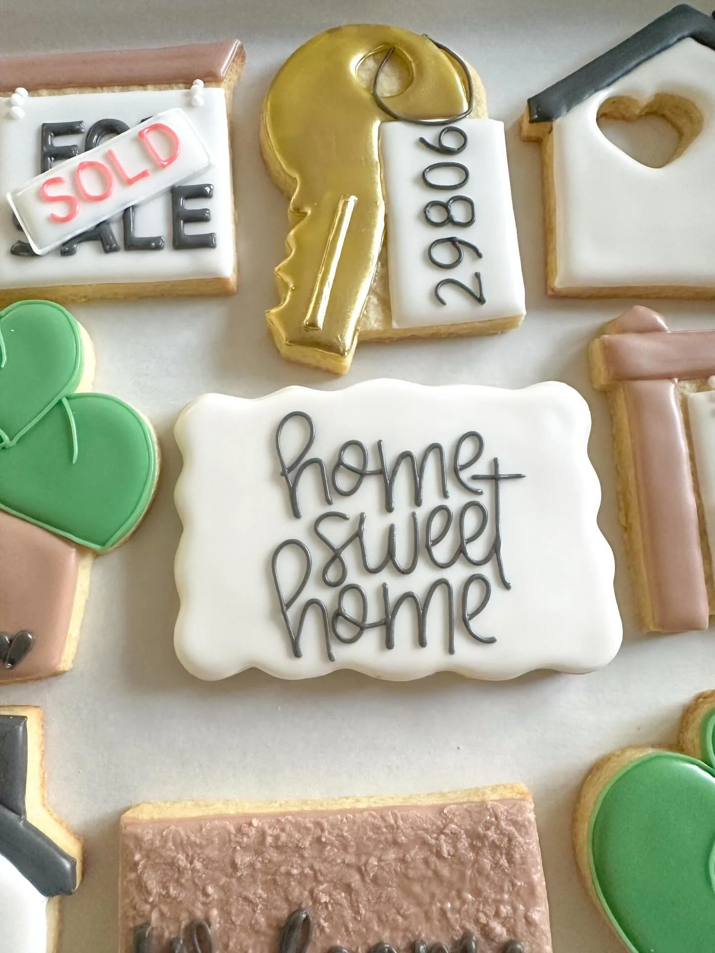 Home sweet home 🏡 
Tag a realtor, new homeowner, or someone who just moved that would love this cookie set 🔑🍪

#customsugarcookies #housewarmingparty #clevelandcookies #justsold #sugarcookieart
